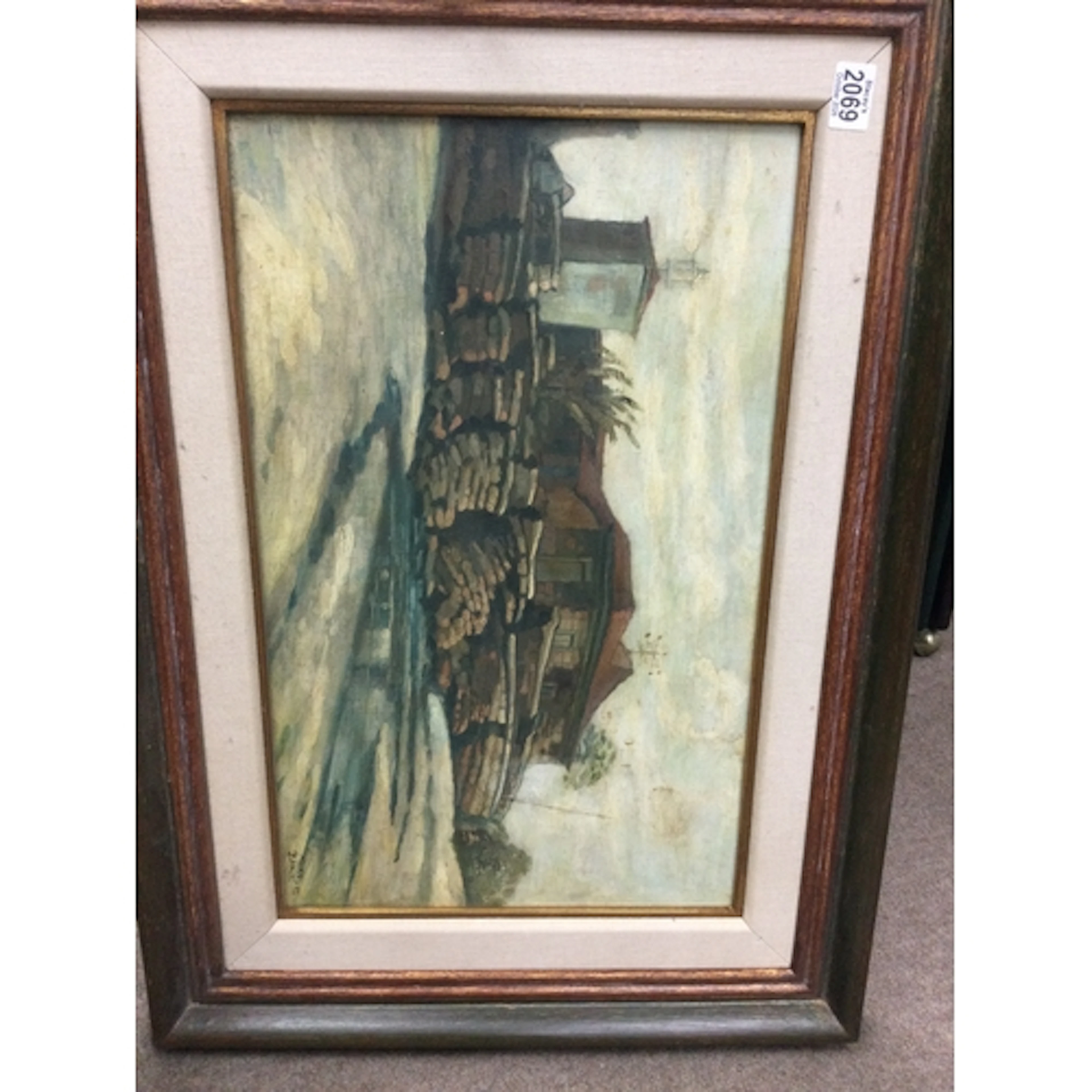 Framed oil painting depicting a rustic building. Signed Mari...
