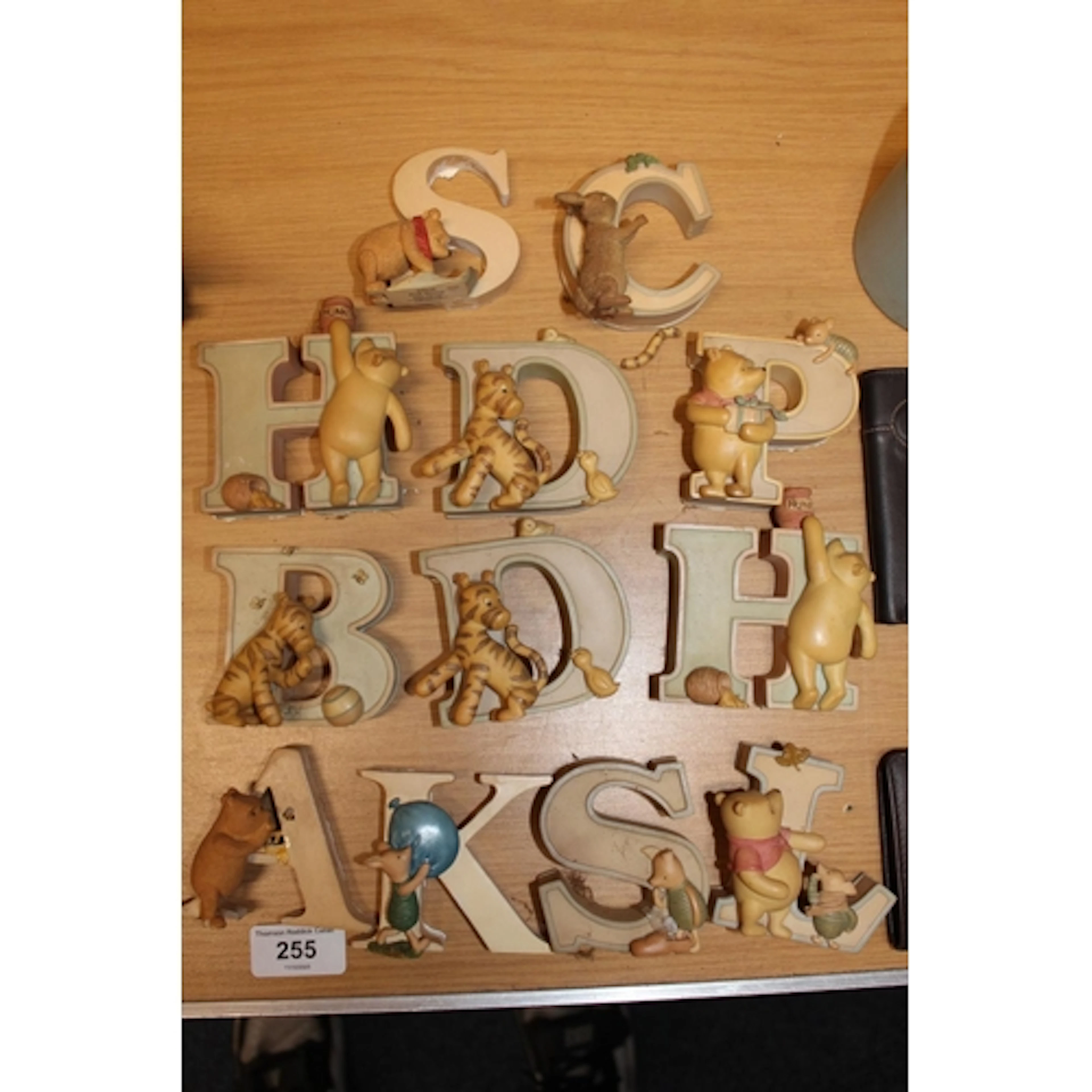 Twelve Winnie the Pooh themed figural letter ornaments, c.8c...