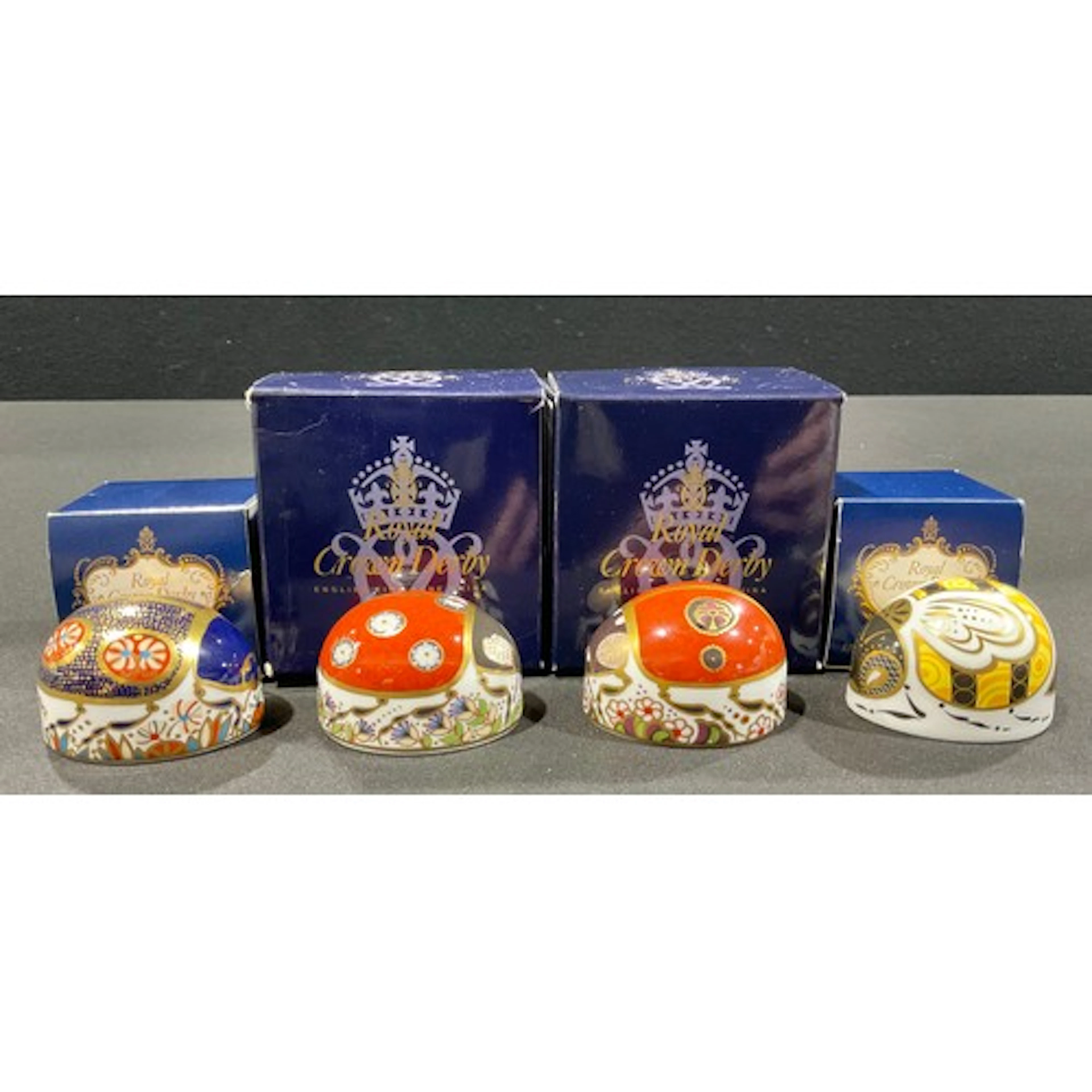A Royal Crown Derby Paperweight, Red Ladybird with seven spo...
