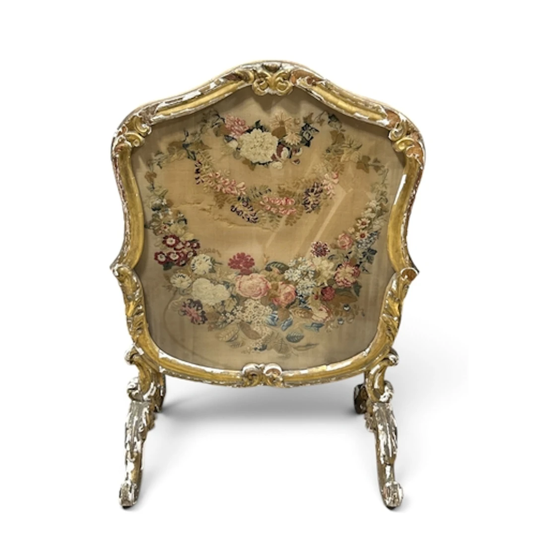 AN EARLY 19TH CENTURY GILT GESSO FIRE SCREEN With needlepoin...