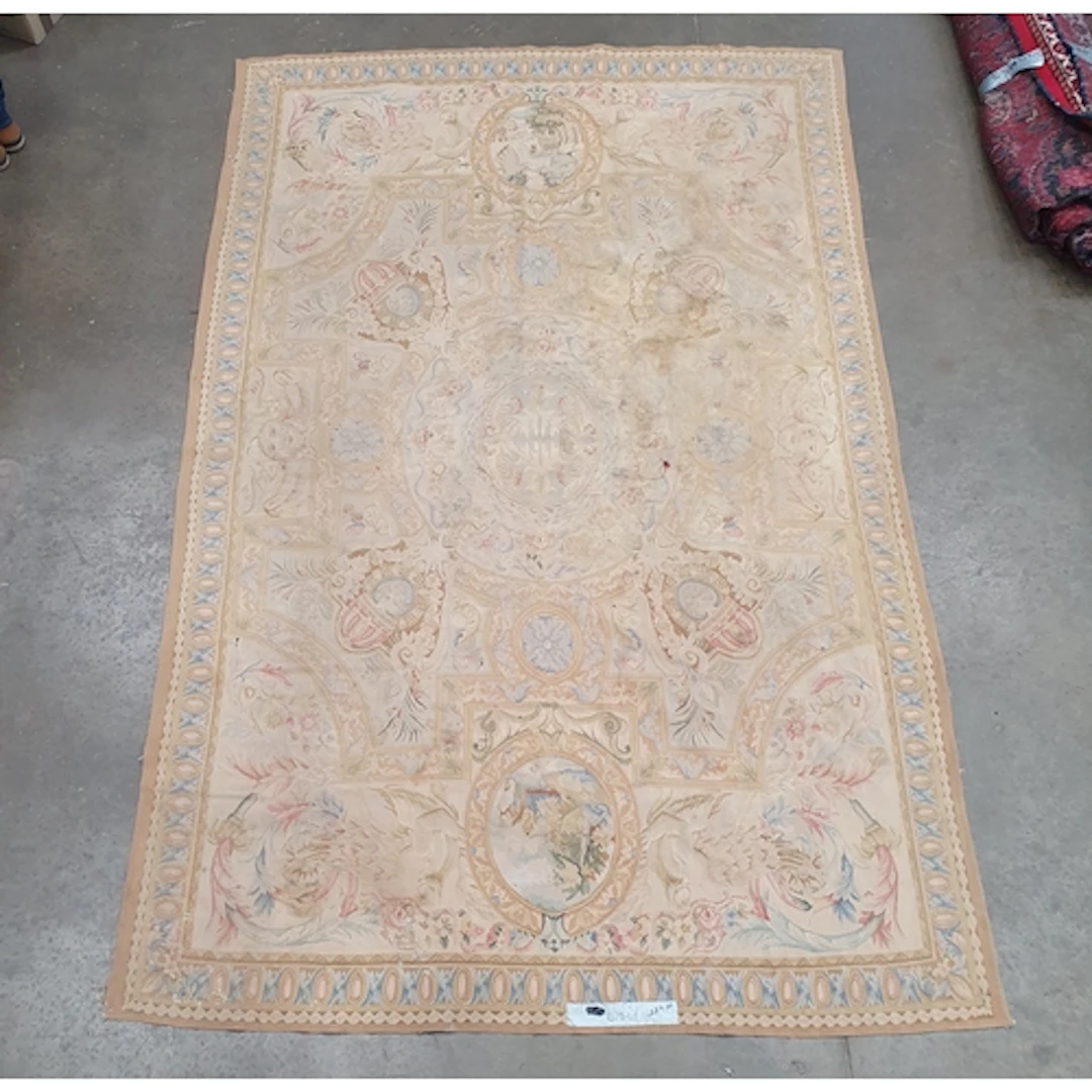 A Continental Wall Hanging on yellow/beige ground with oval ...