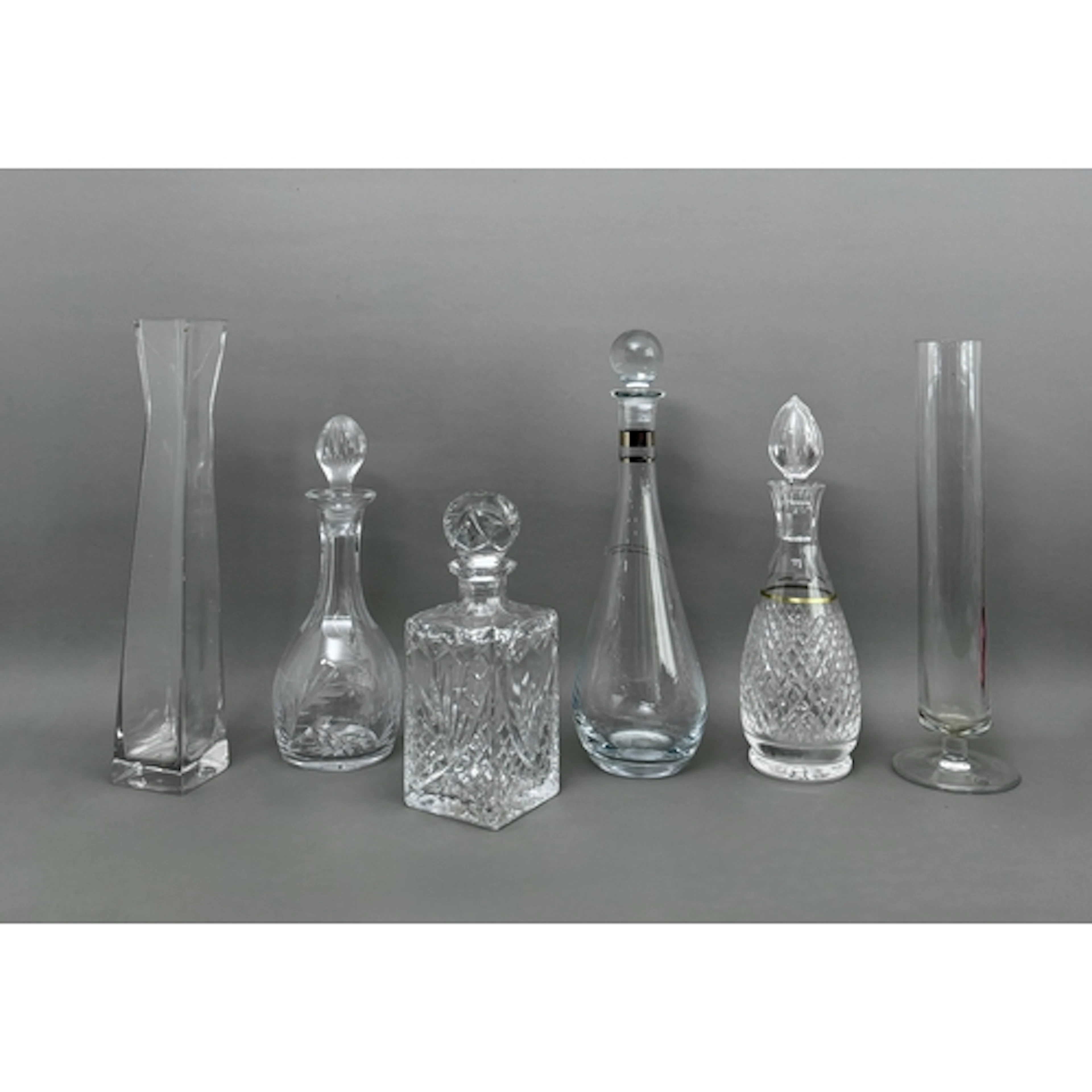 Four crystal and cut glass decanters - including a Waterford...