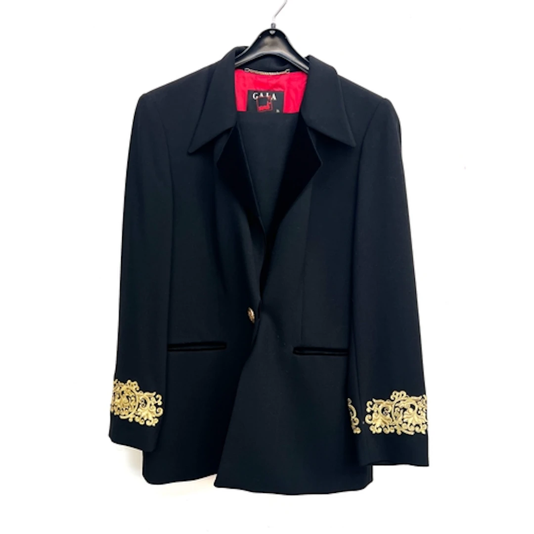 A Mondi Gala black wool trouser suit, the jacket with gold t...