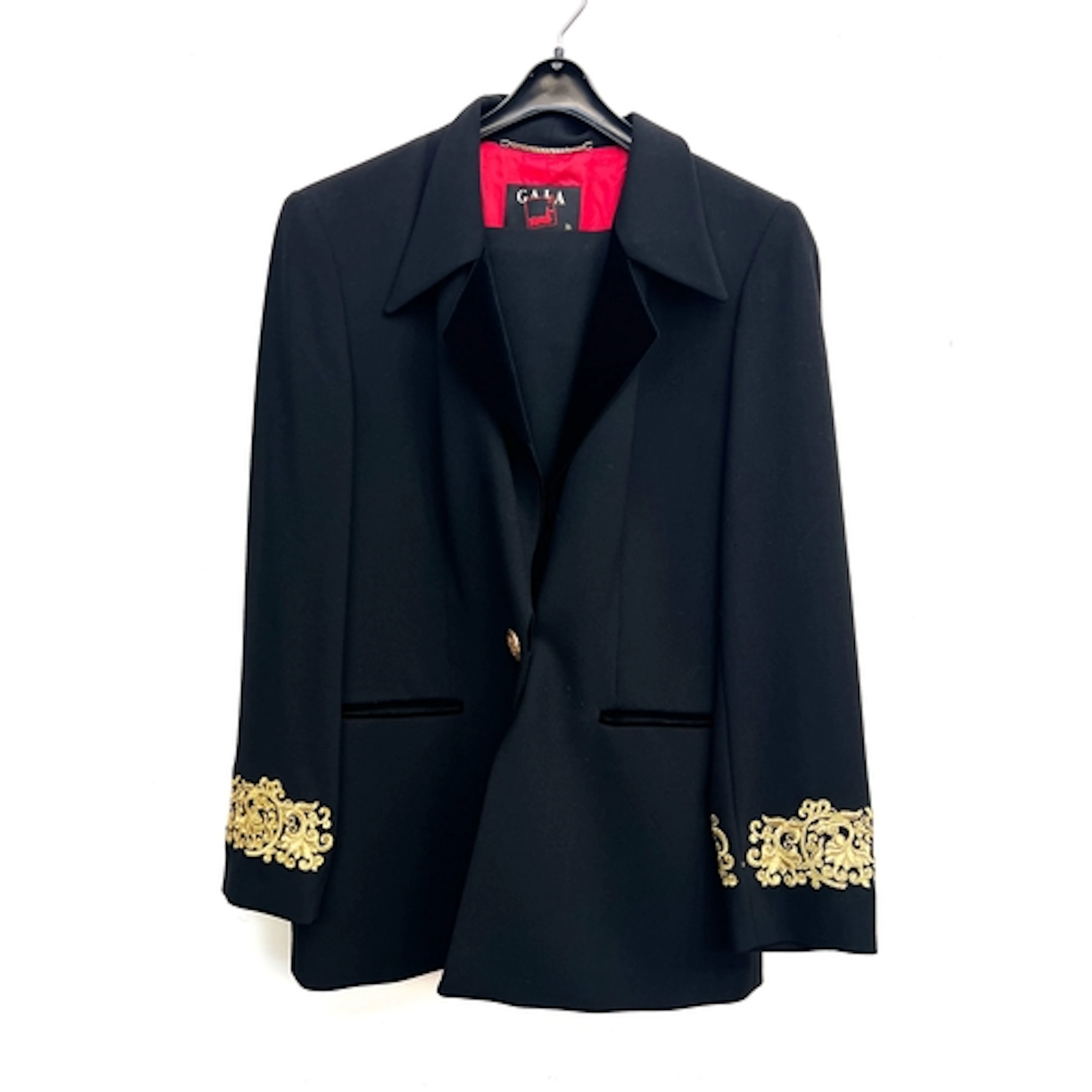 A Mondi Gala black wool trouser suit, the jacket with gold t...