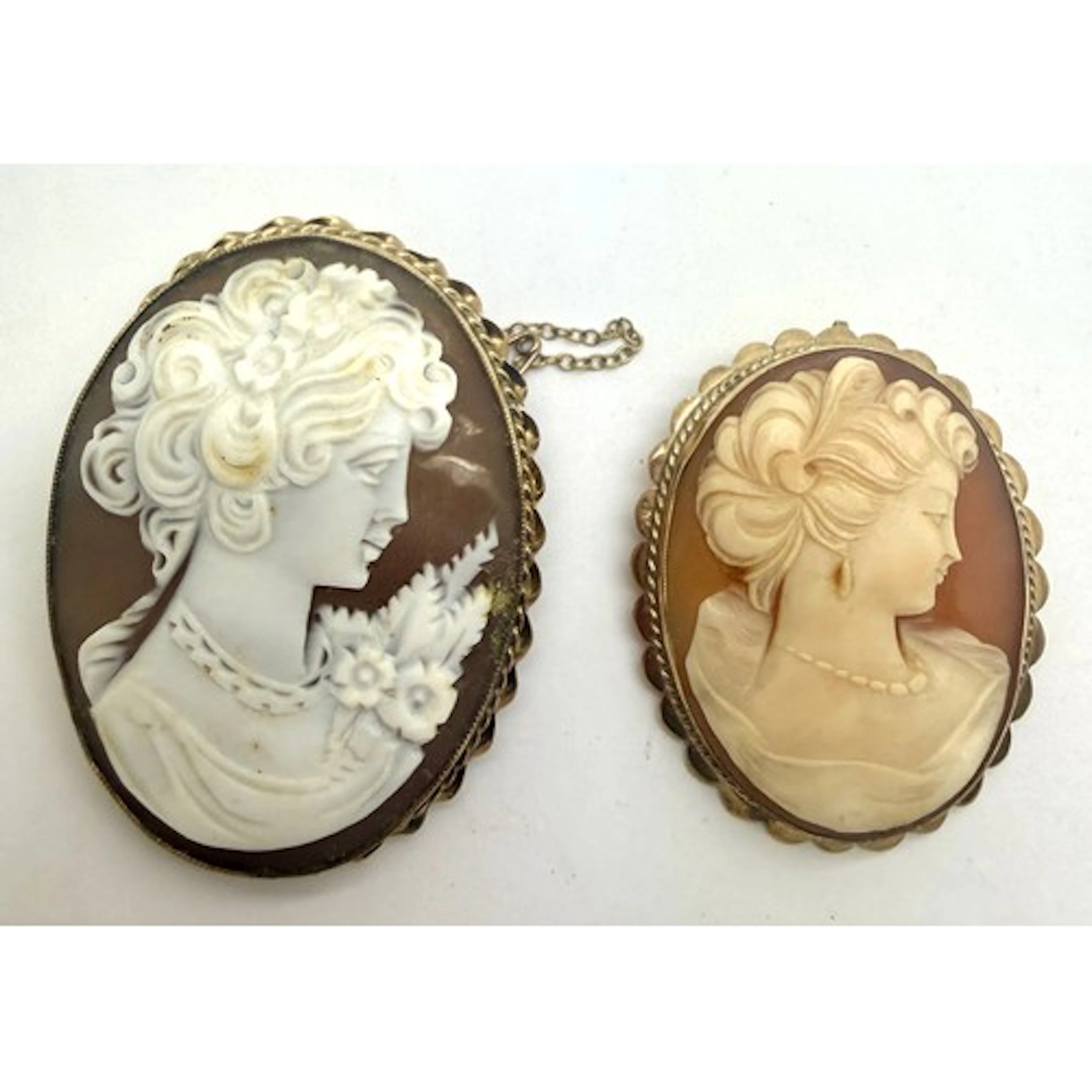 Two carved shell cameo brooches set in 9 carat gold. Largest...