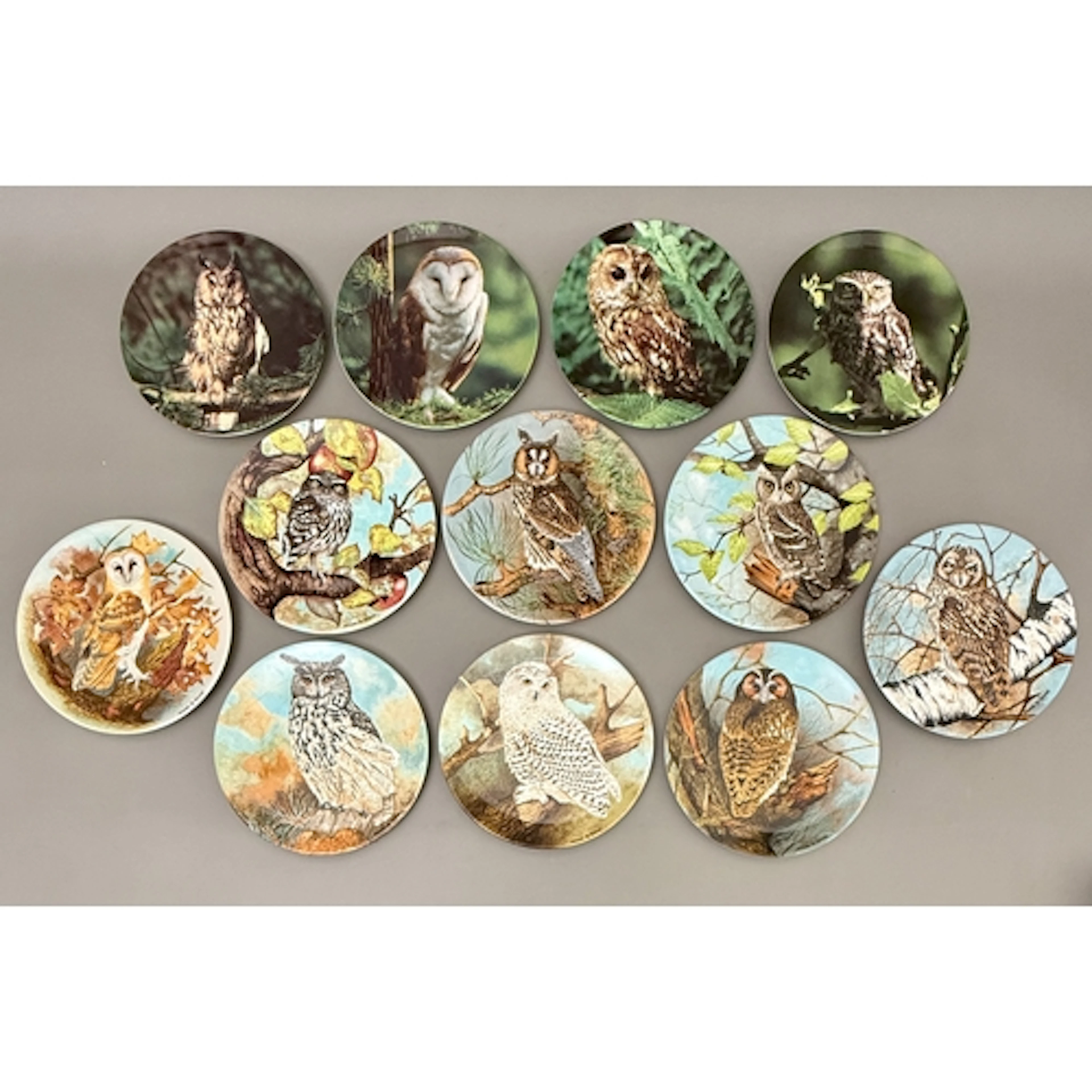 A set of eight Coalport 'The Wise Owl' limited edition colle...