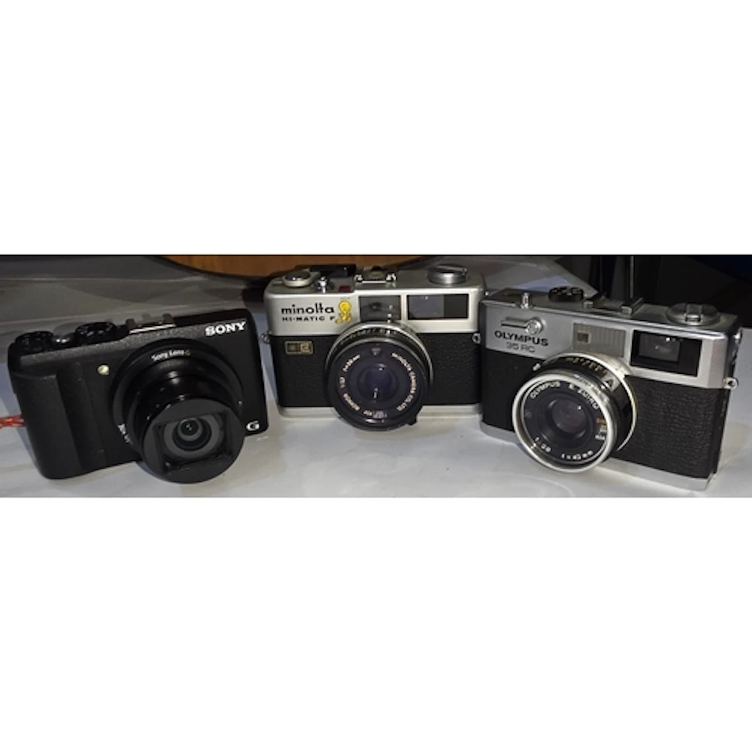A Sony Cyber-shot Exmor R Sony Lens G camera, a vintage Olym...