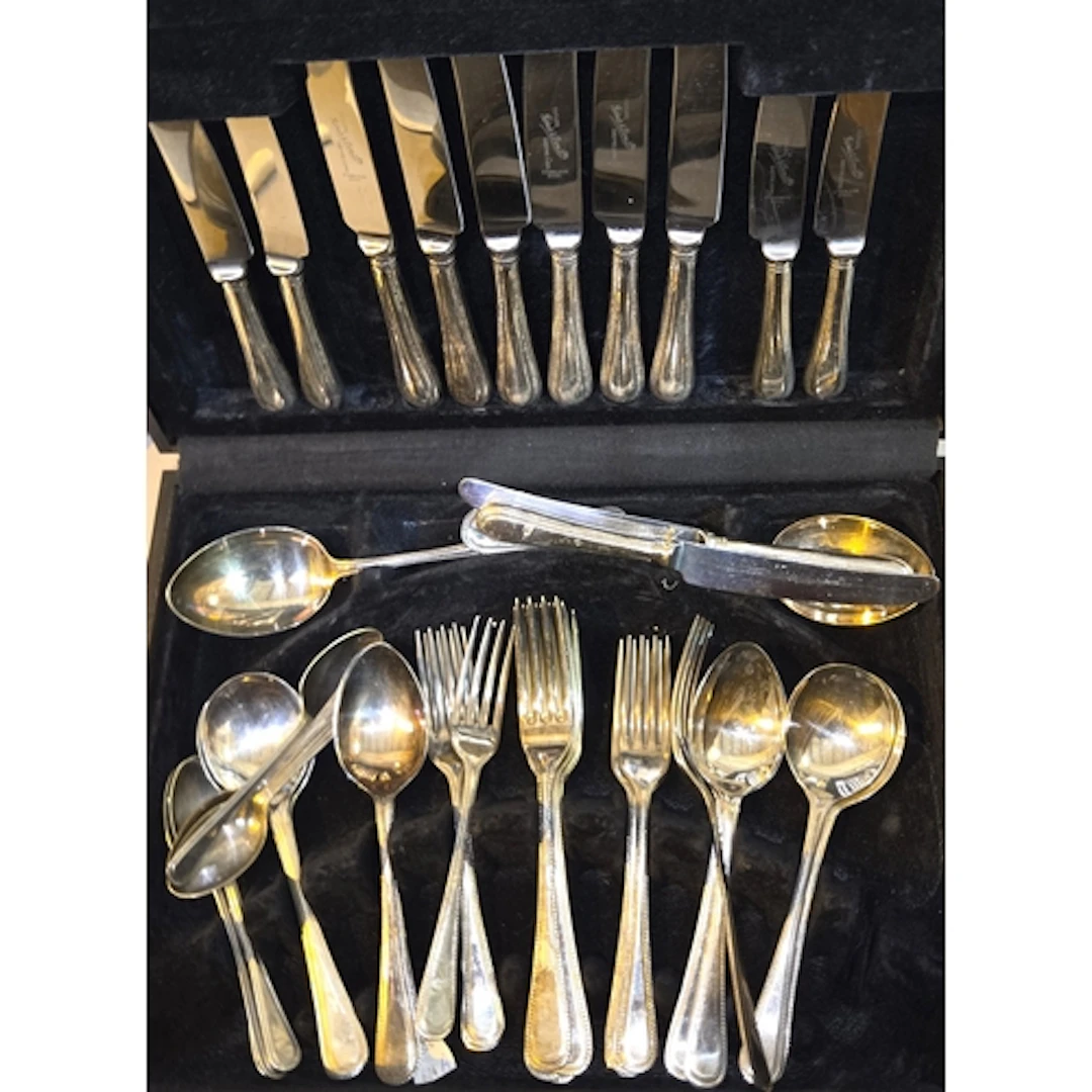 A part canteen of beaded border cutlery in fitted wooden cas...