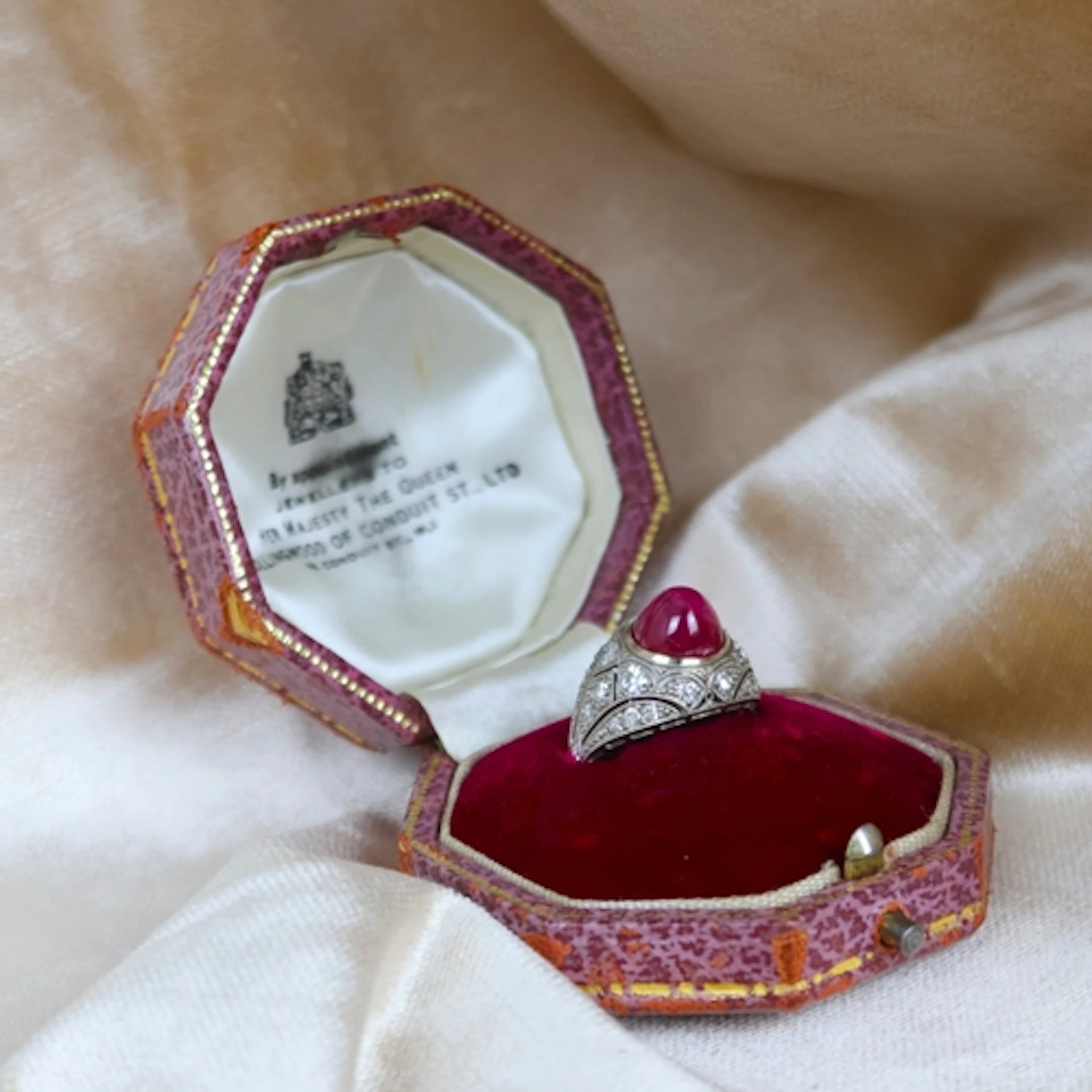 An Art Deco cabochon ruby and diamond ring, the certified ru...