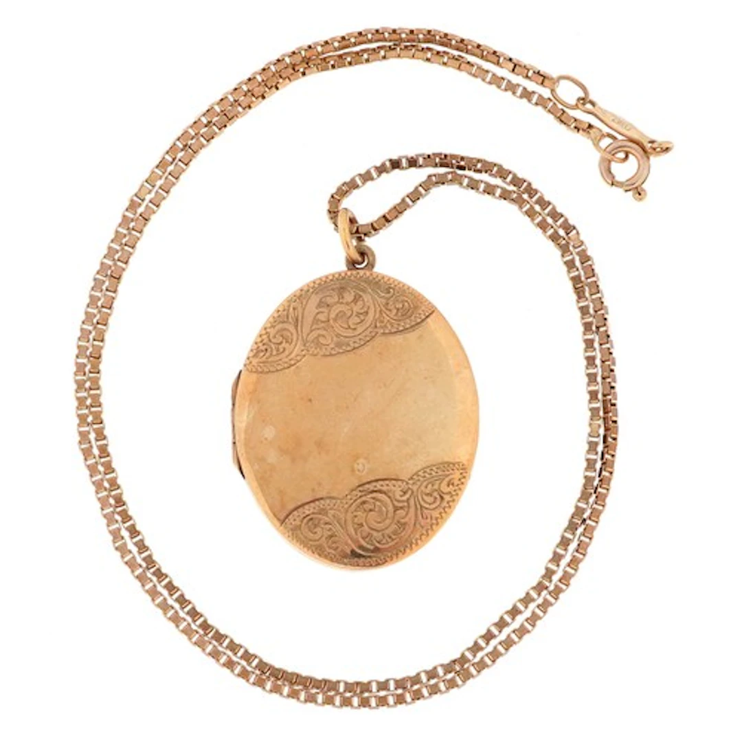 9ct gold locket with engraved decoration on a 9ct gold box l...