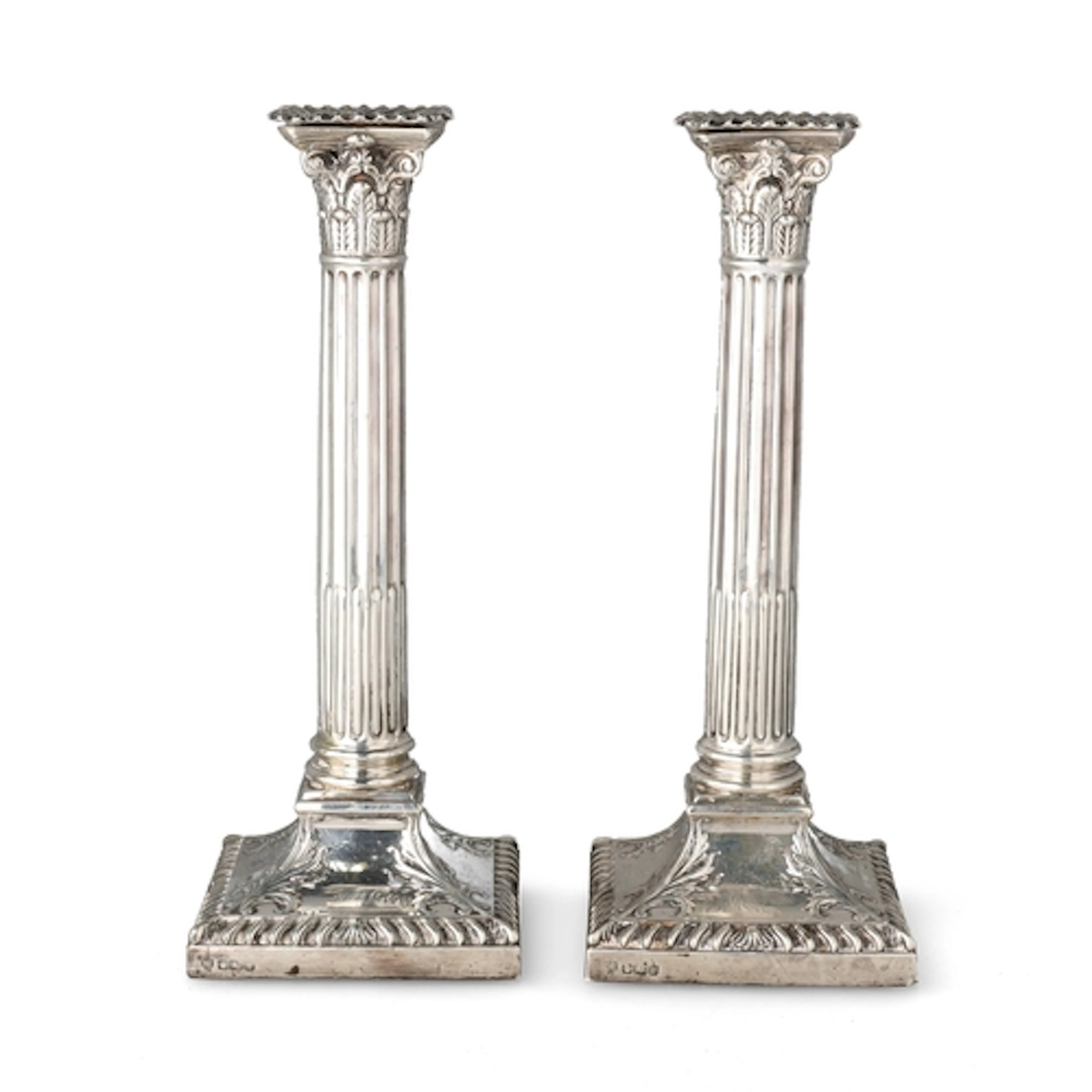 A PAIR OF GEORGE III STYLE SILVER CORINTHIAN COLUMN CANDLEST...