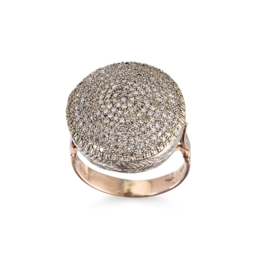 A DIAMOND CLUSTER RING, pavé set, of circular form, mounted ...