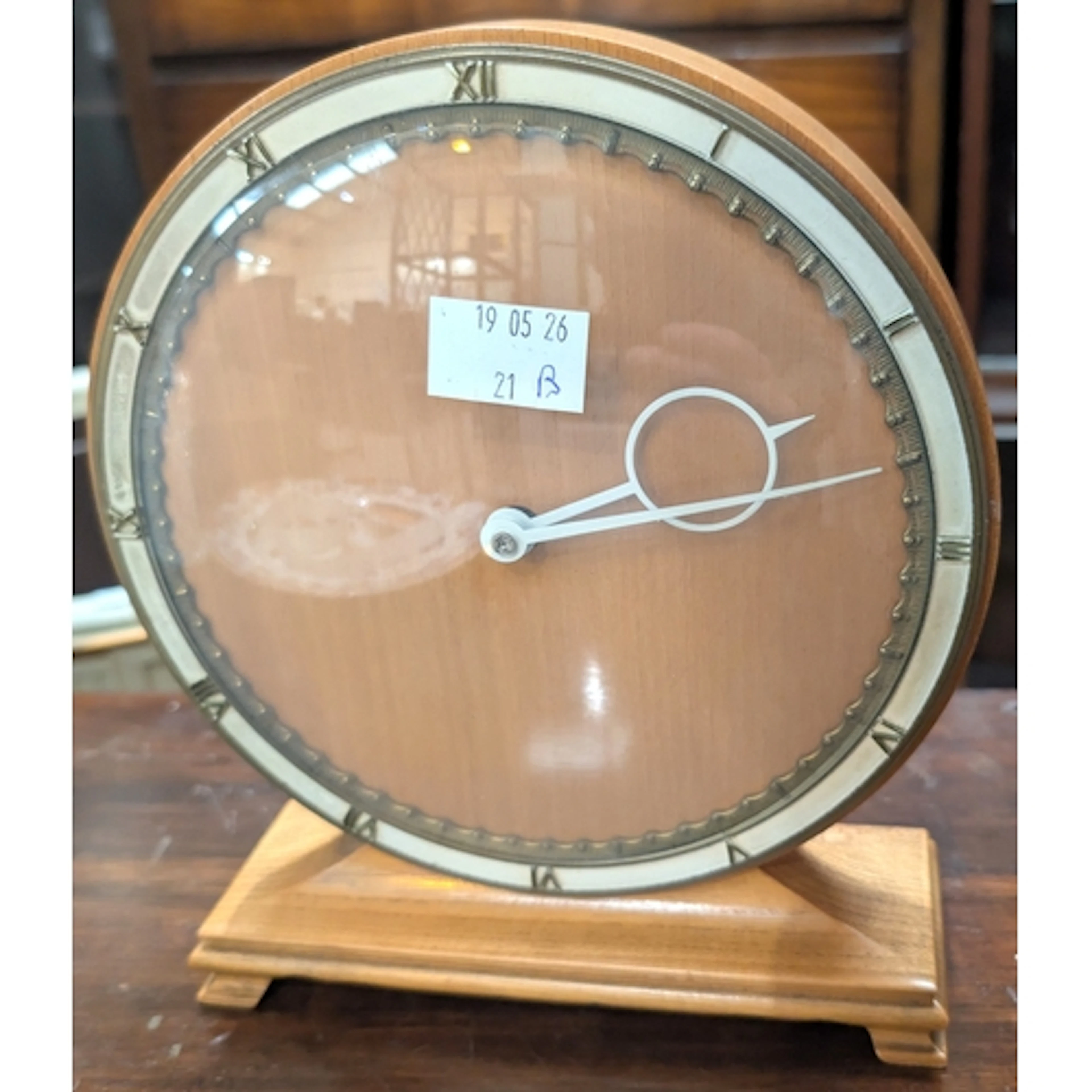 A Bauhaus design Art Deco circular lightwood mantel clock de...