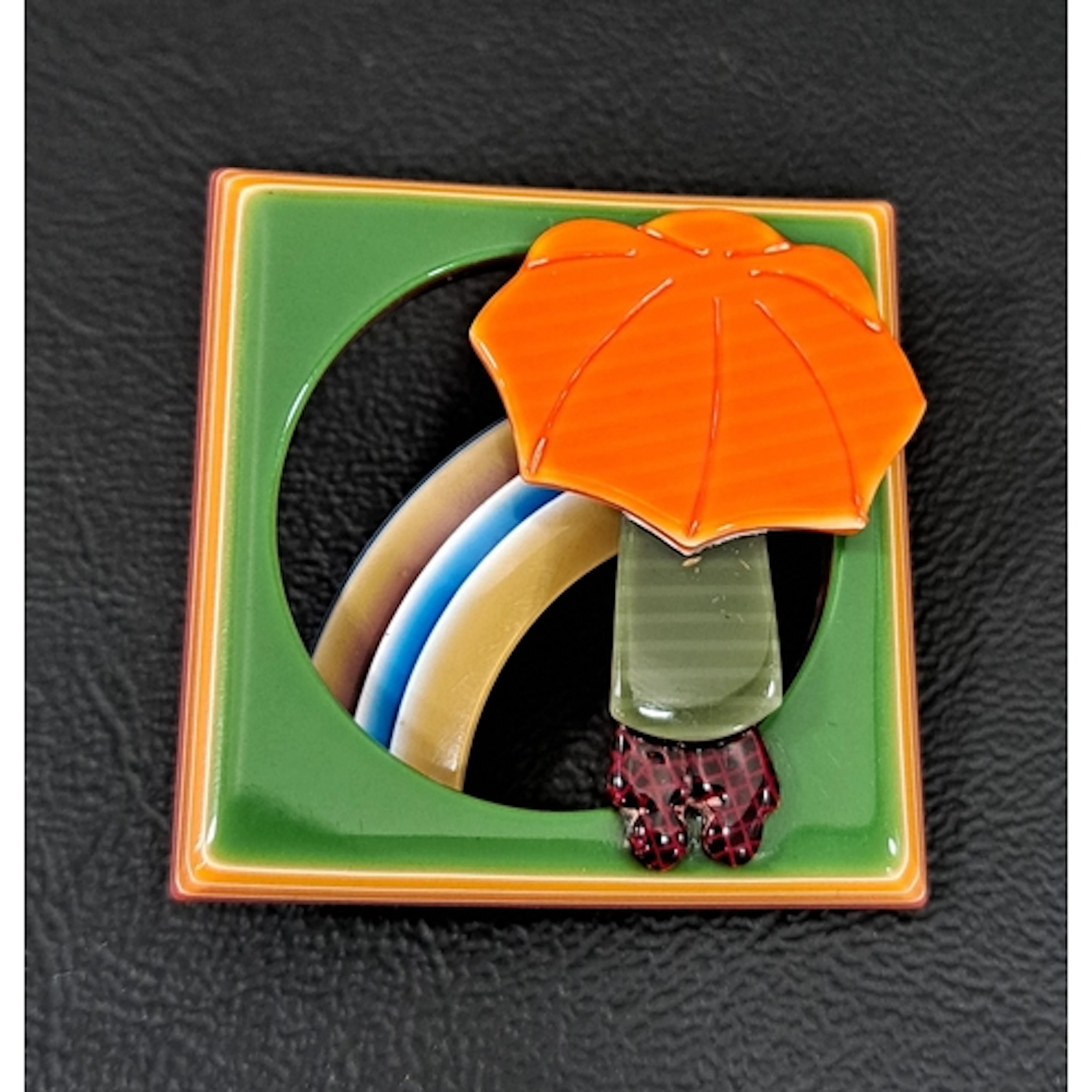 LEA STEIN UMBRELLA GIRL AND RAINBOW BROOCH the figure with b...