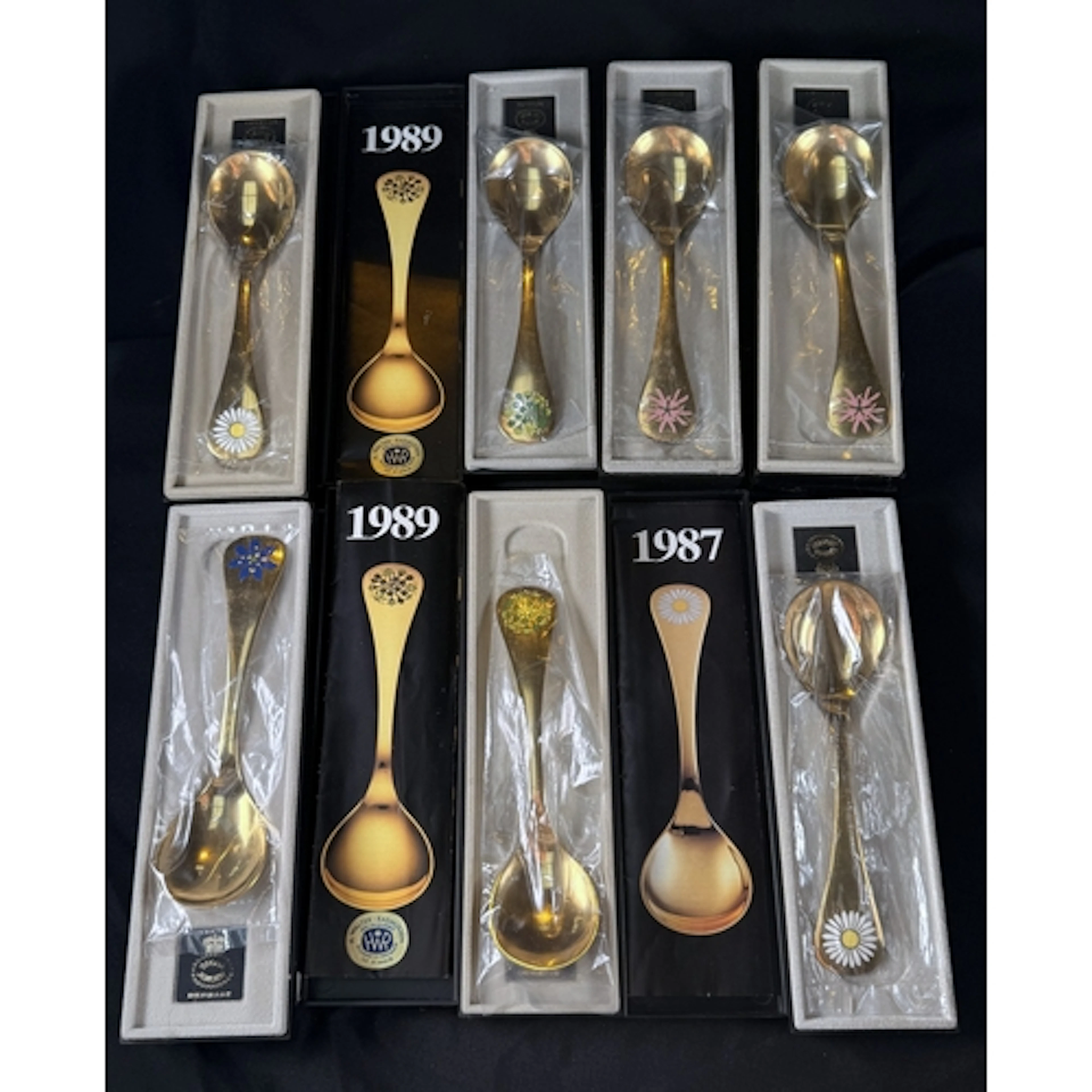 George Jensen: Seven gold plated Sterling silver year spoons...