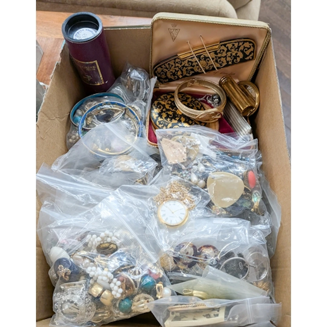A large quantity of costume jewellery, vintage compacts etc