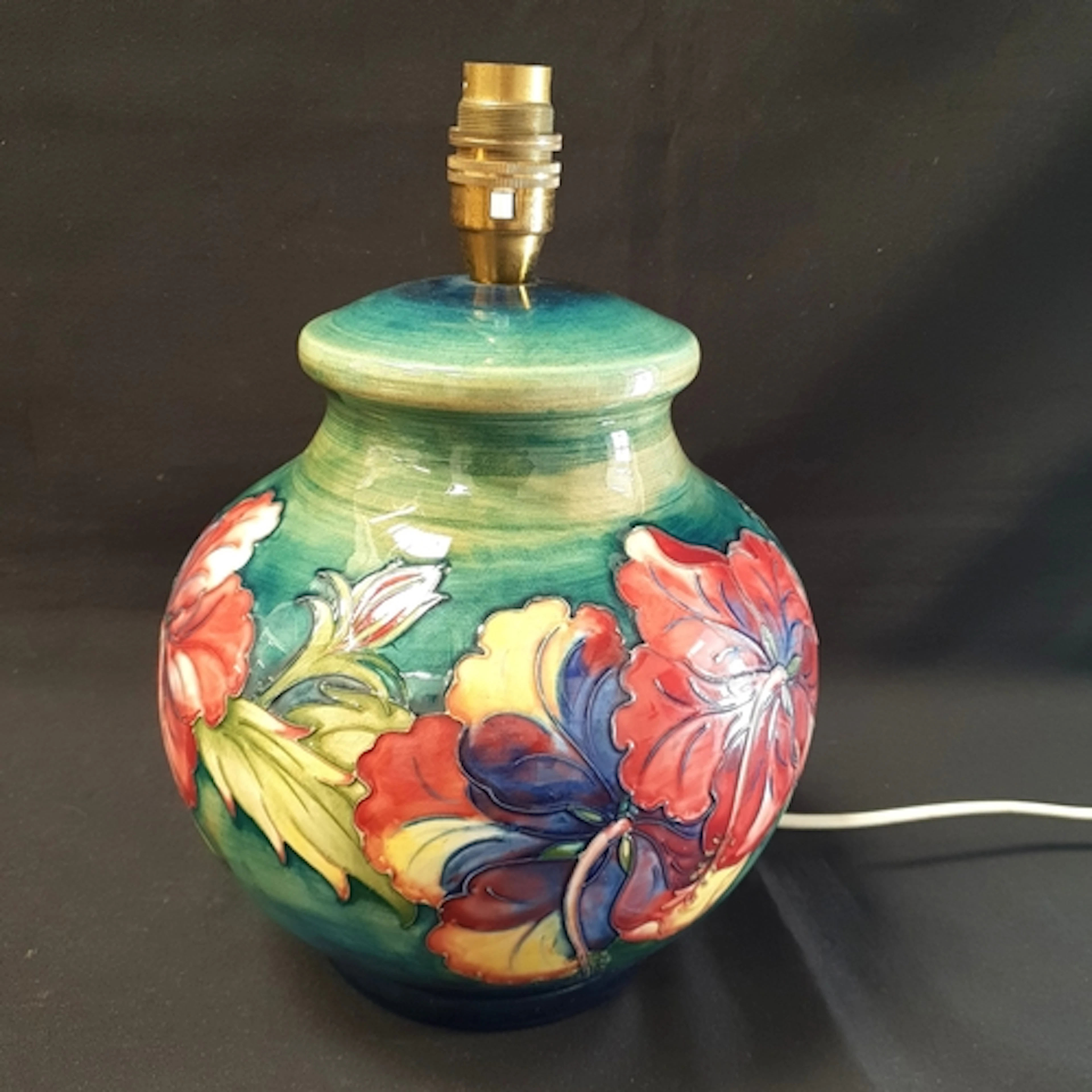 MOORCROFT POTTERY TABLE LAMP of baluster form and decorated ...