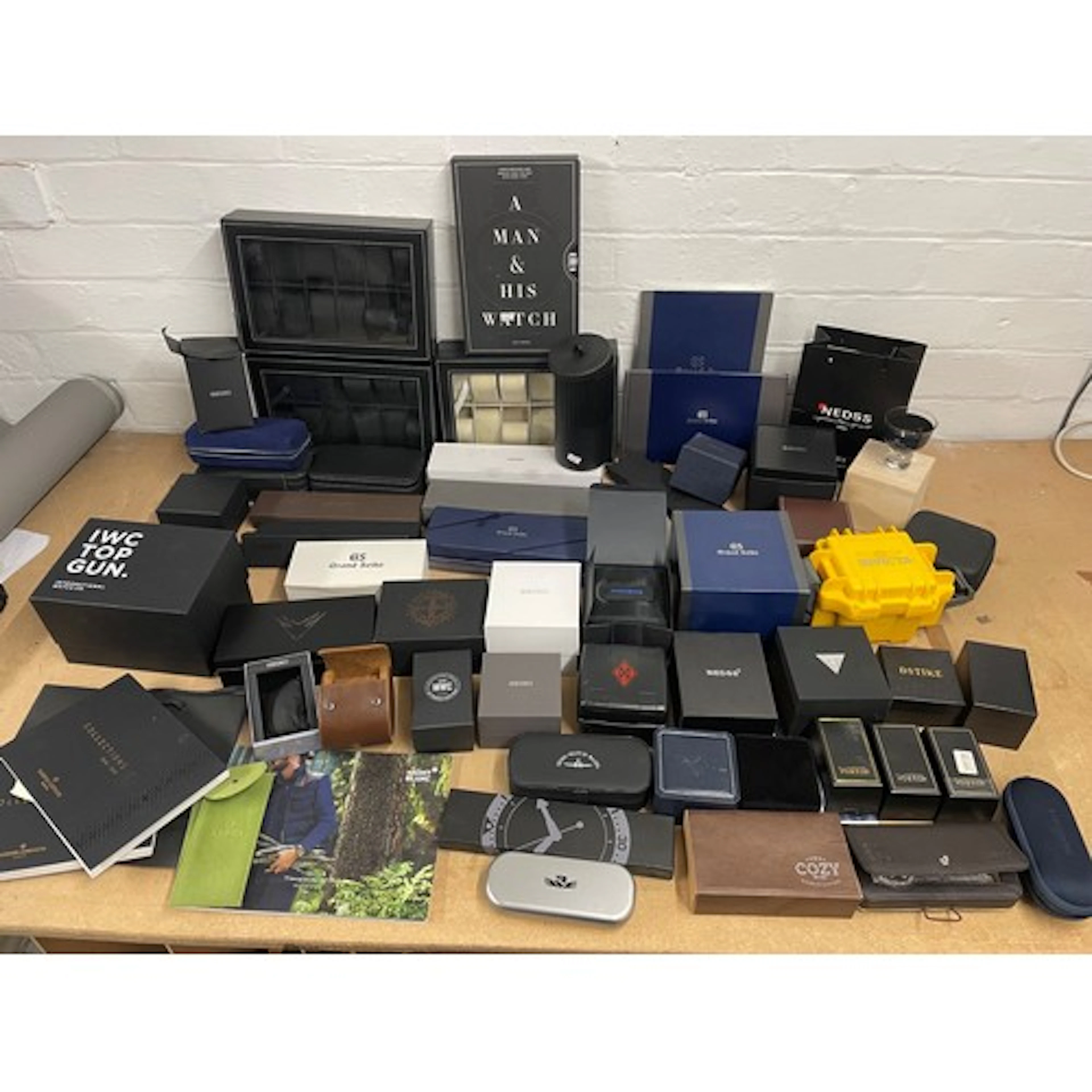 Large collection of empty watch boxes and accessories to inc...