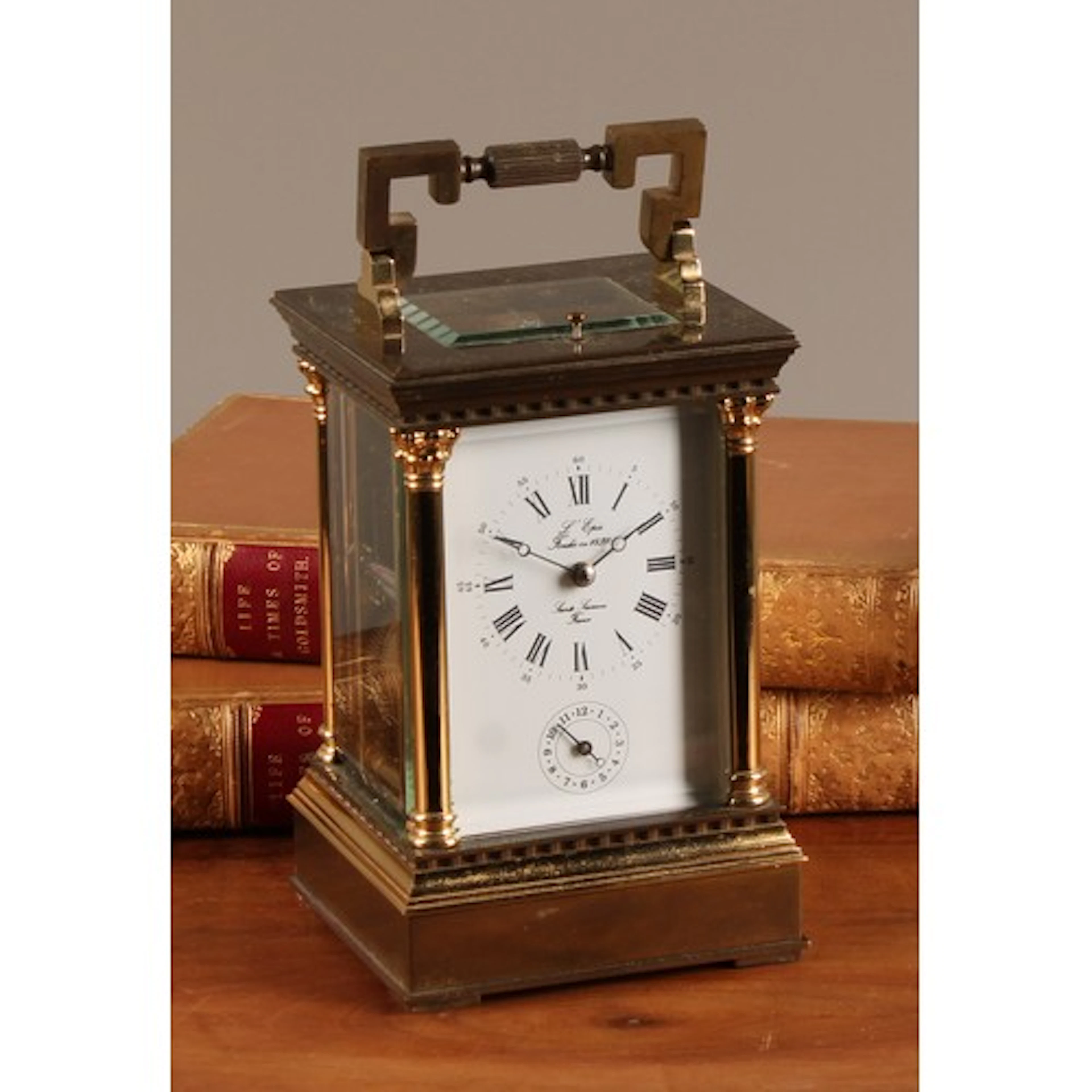A 20th century French repeating bronze and brass cased carri...