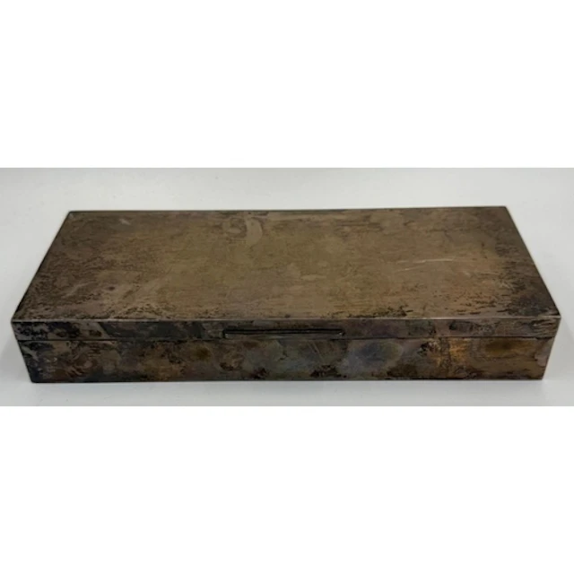 A silver cigarette box hallmarked for Birmingham 1969 by Elk...