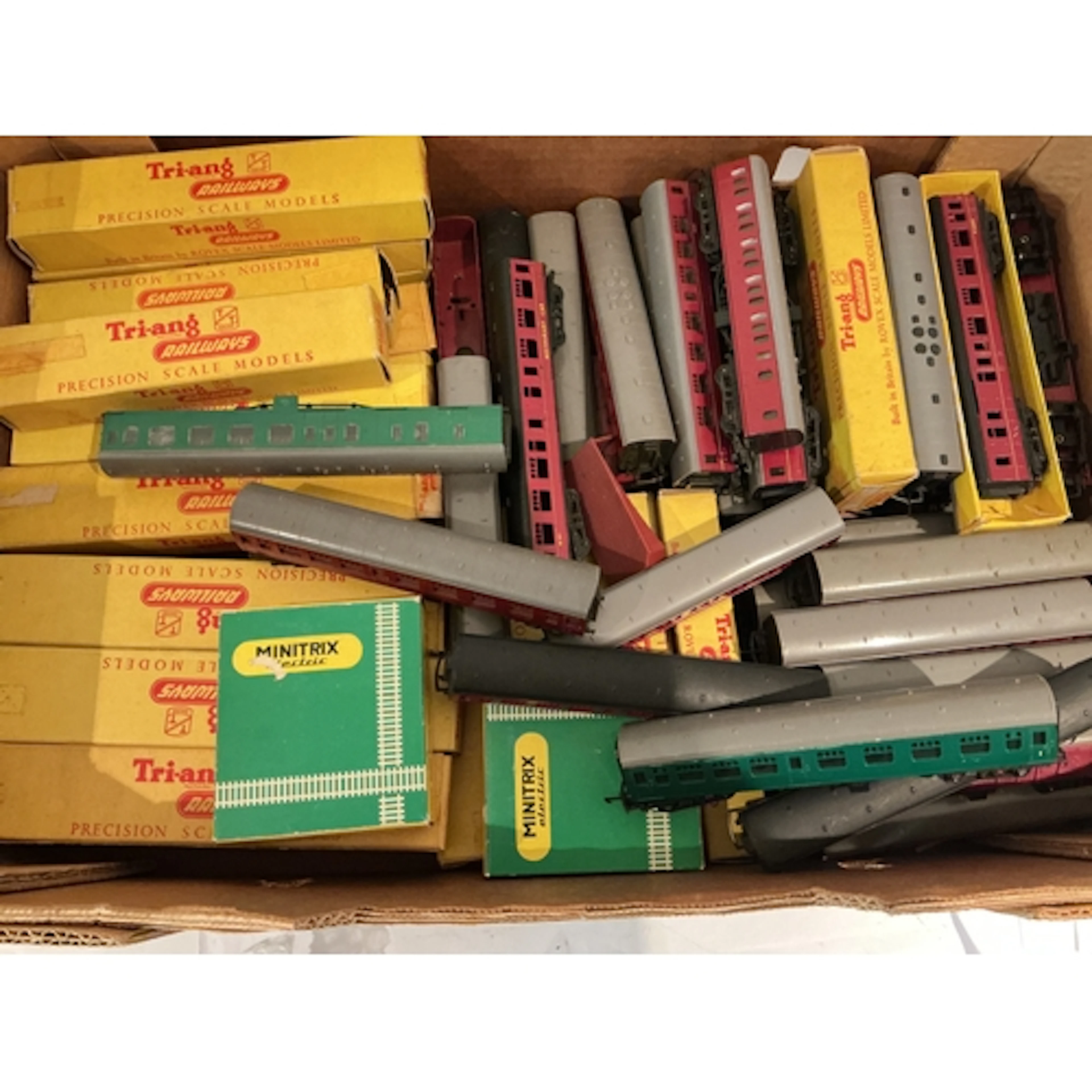 A Crate Containing Boxed And Loose Tri-Ang TT Gauge Coaches.