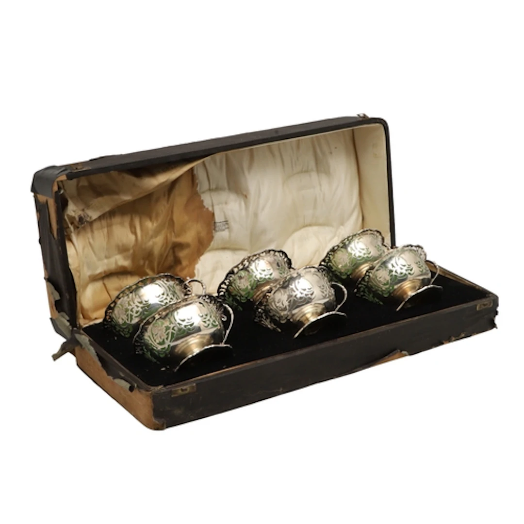 A CASED SET OF SIX GEORGE V SILVER DESSERT COUPES. With pier...