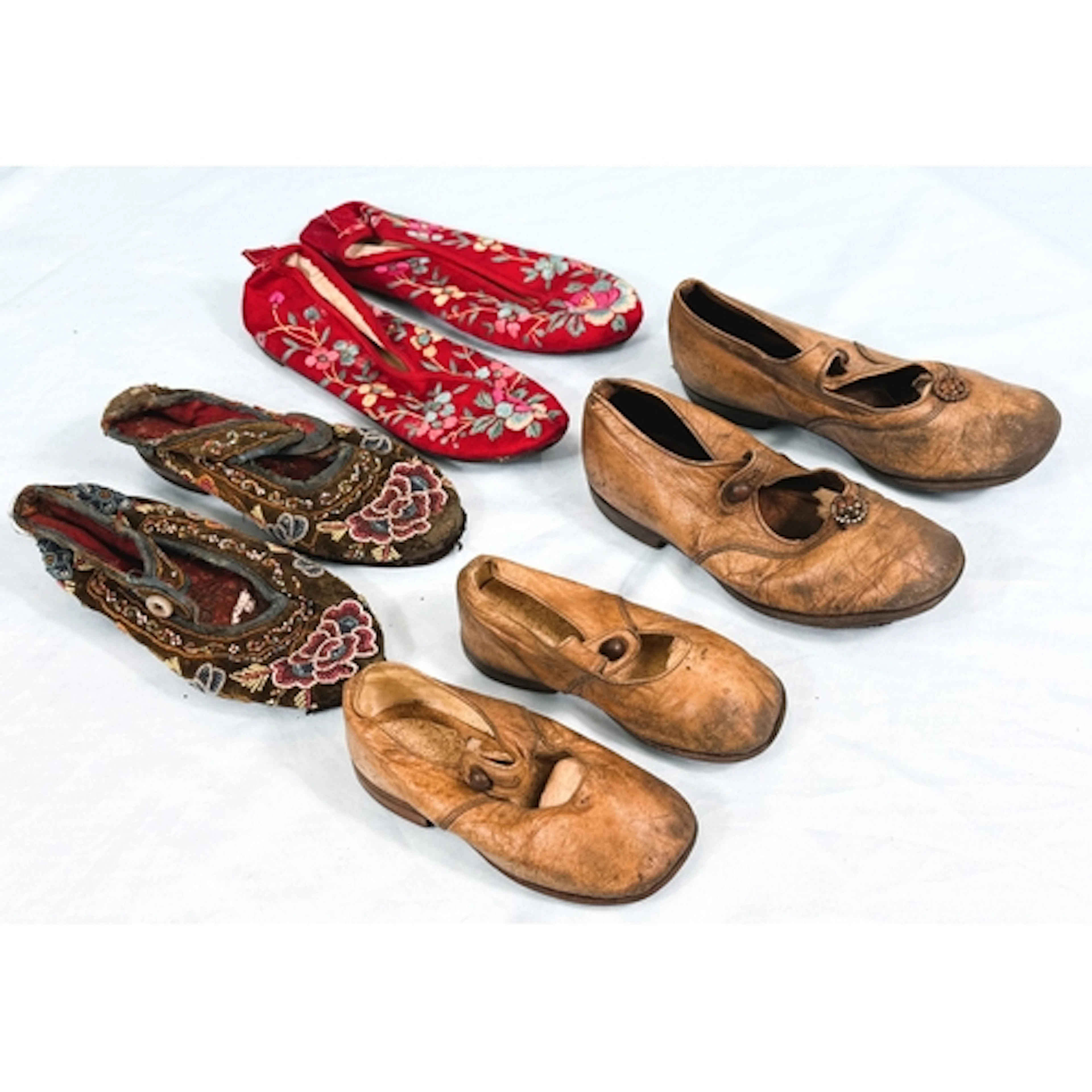 A pair of antique child's shoes in dark velvet with all-over...