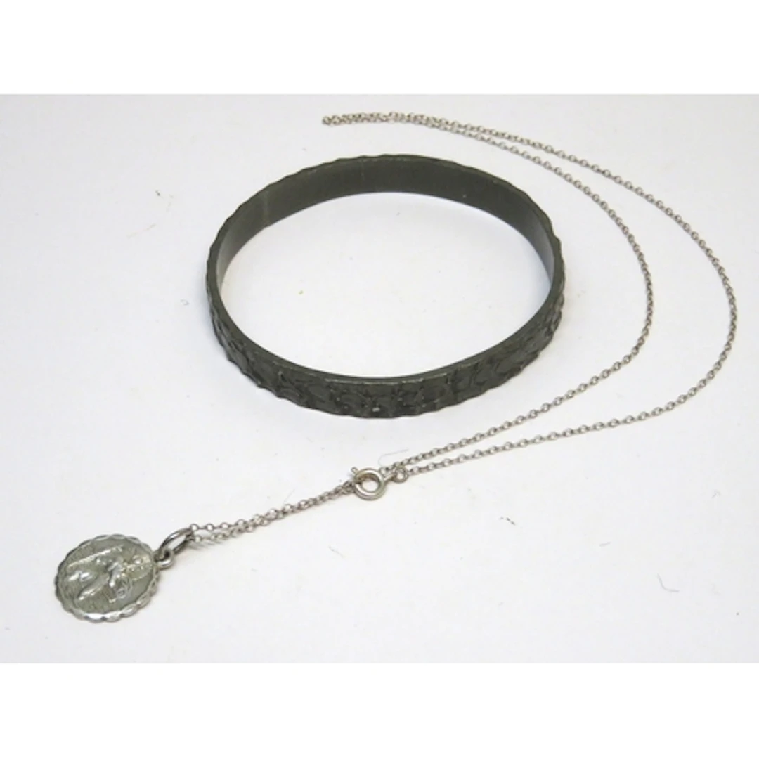 Georg Jensen pewter bangle, number 217, and a silver St Chri...
