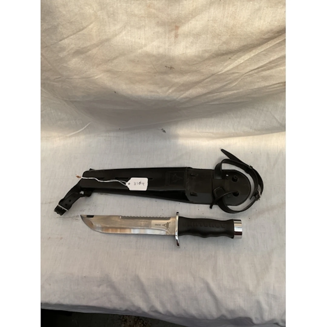 Aqualung divers knife and sheath.