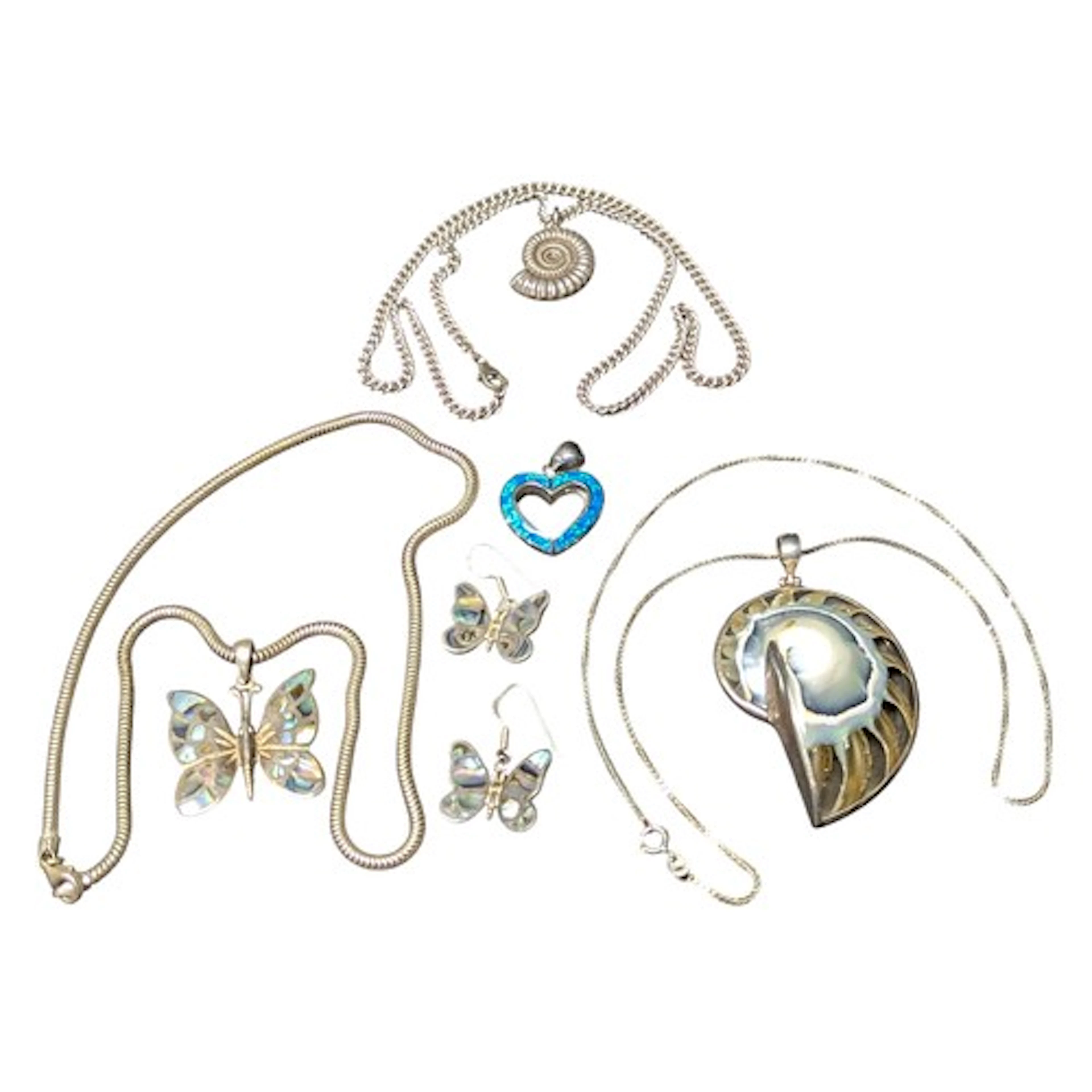 A silver mounted shell pendant necklace; a silver ammonite p...