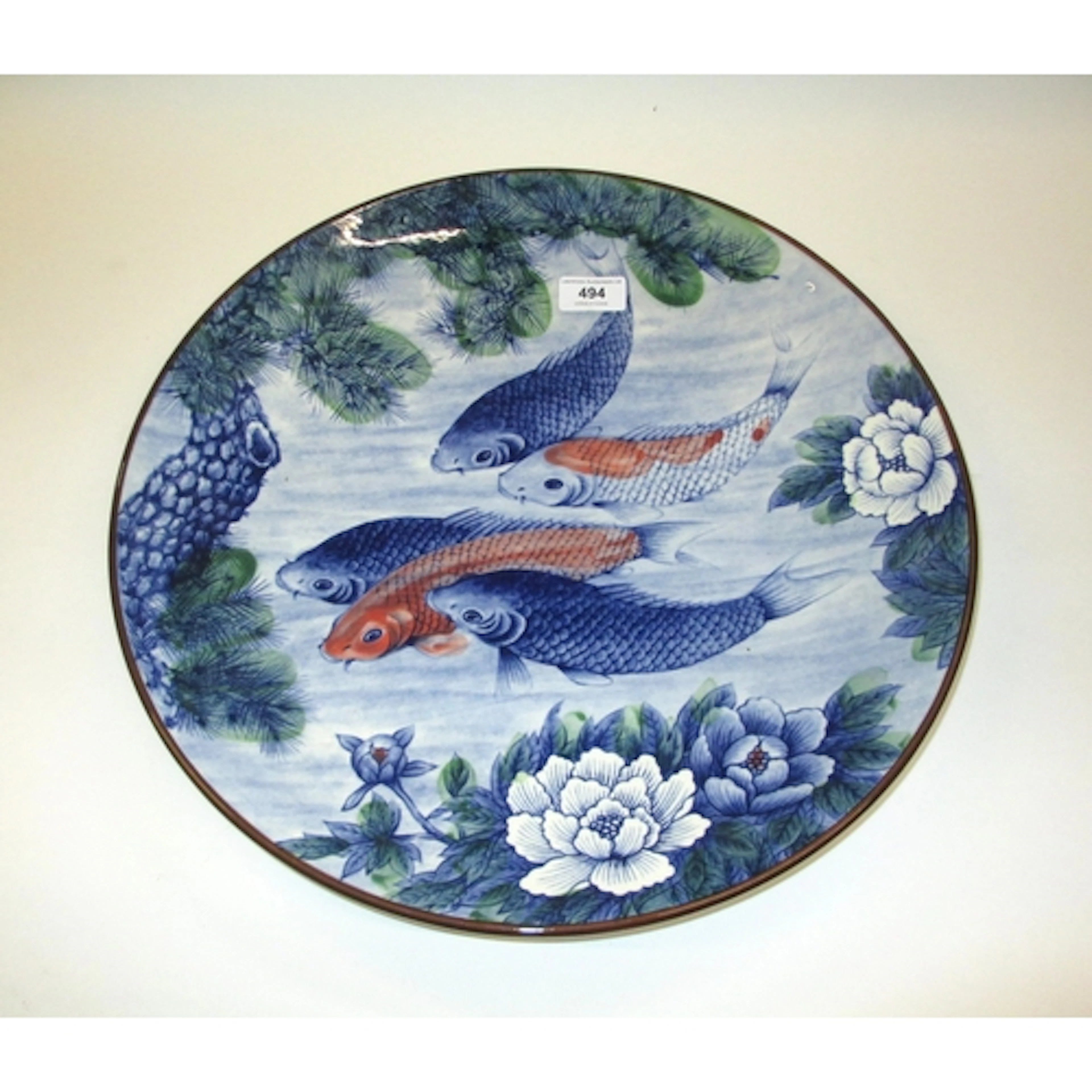 Imari circular pottery charger, painted with fishes, 42cm di...