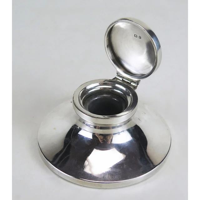 A George V silver capstan inkwell, maker William Neale & Son...