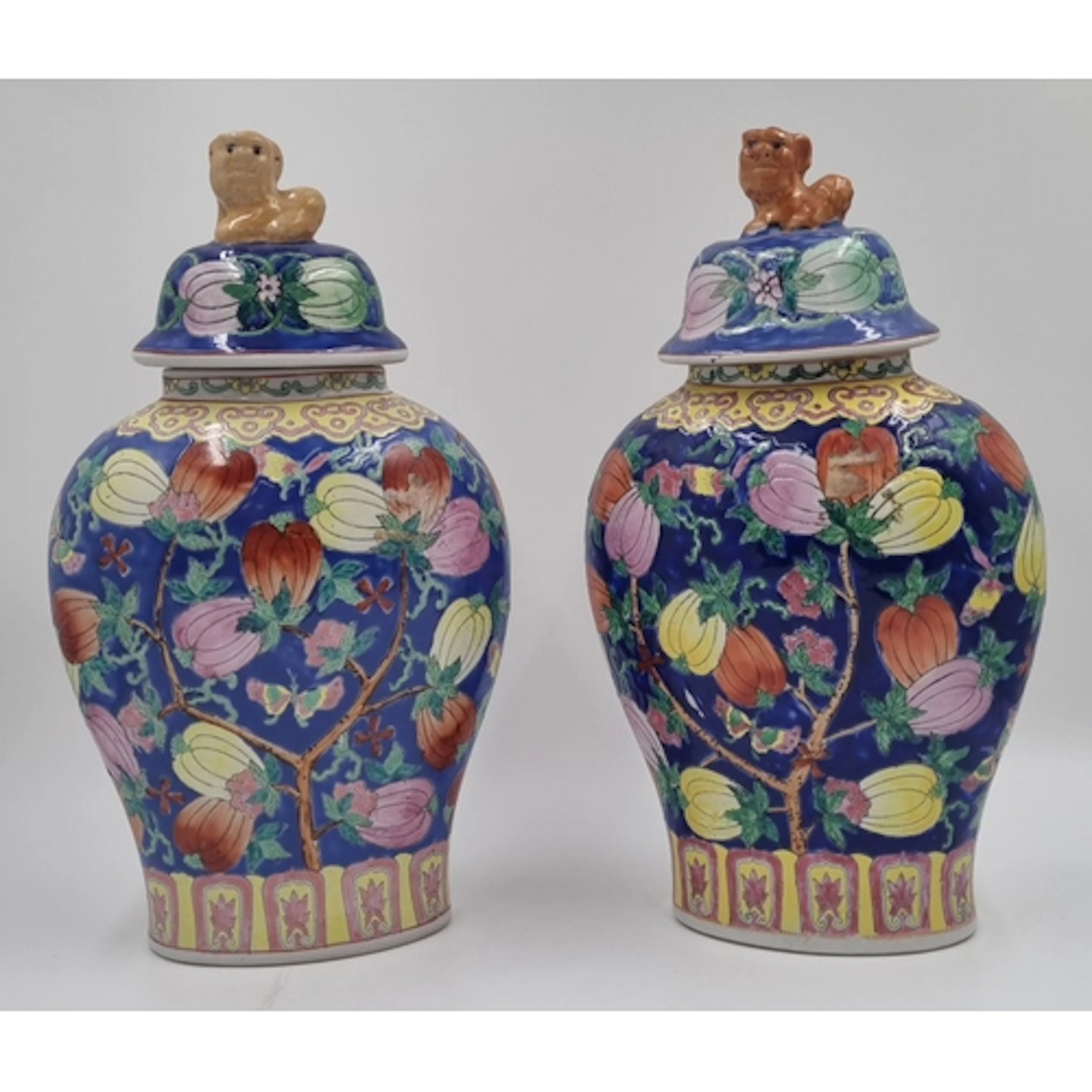 A pair of Chinese-style famille rose porcelain ginger jars w...