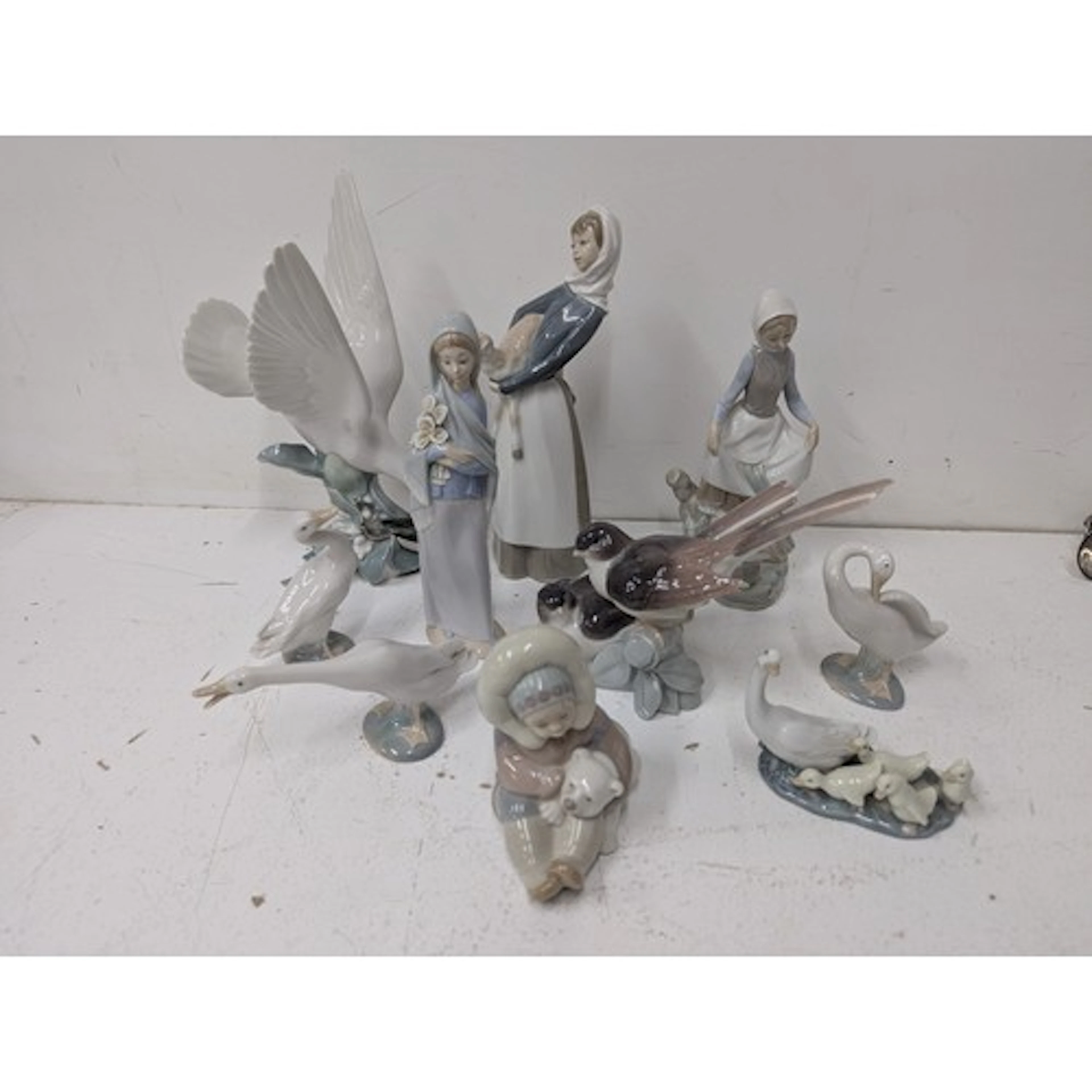 Lladro figurines to include a lady with a lamb no: 4584, Esk...