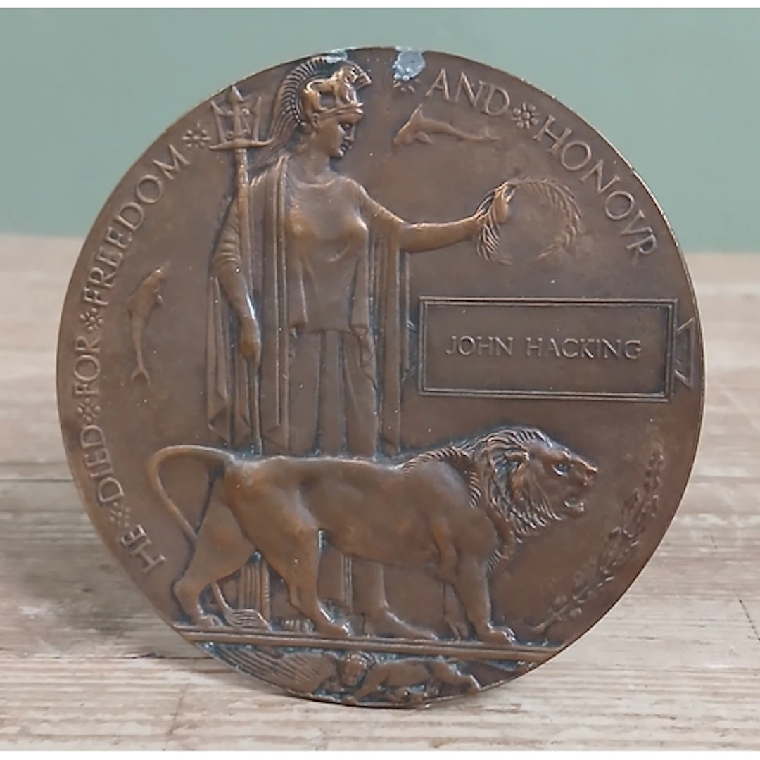 A WWI death plaque in commemoration of John Hacking.