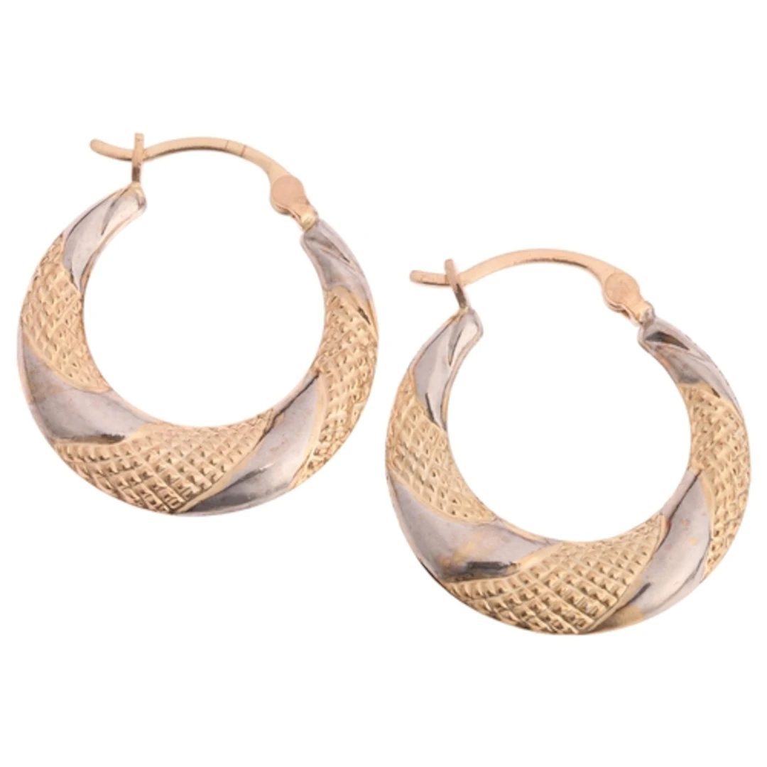 A pair of 9ct two-colour gold hoop earrings, textured and po...