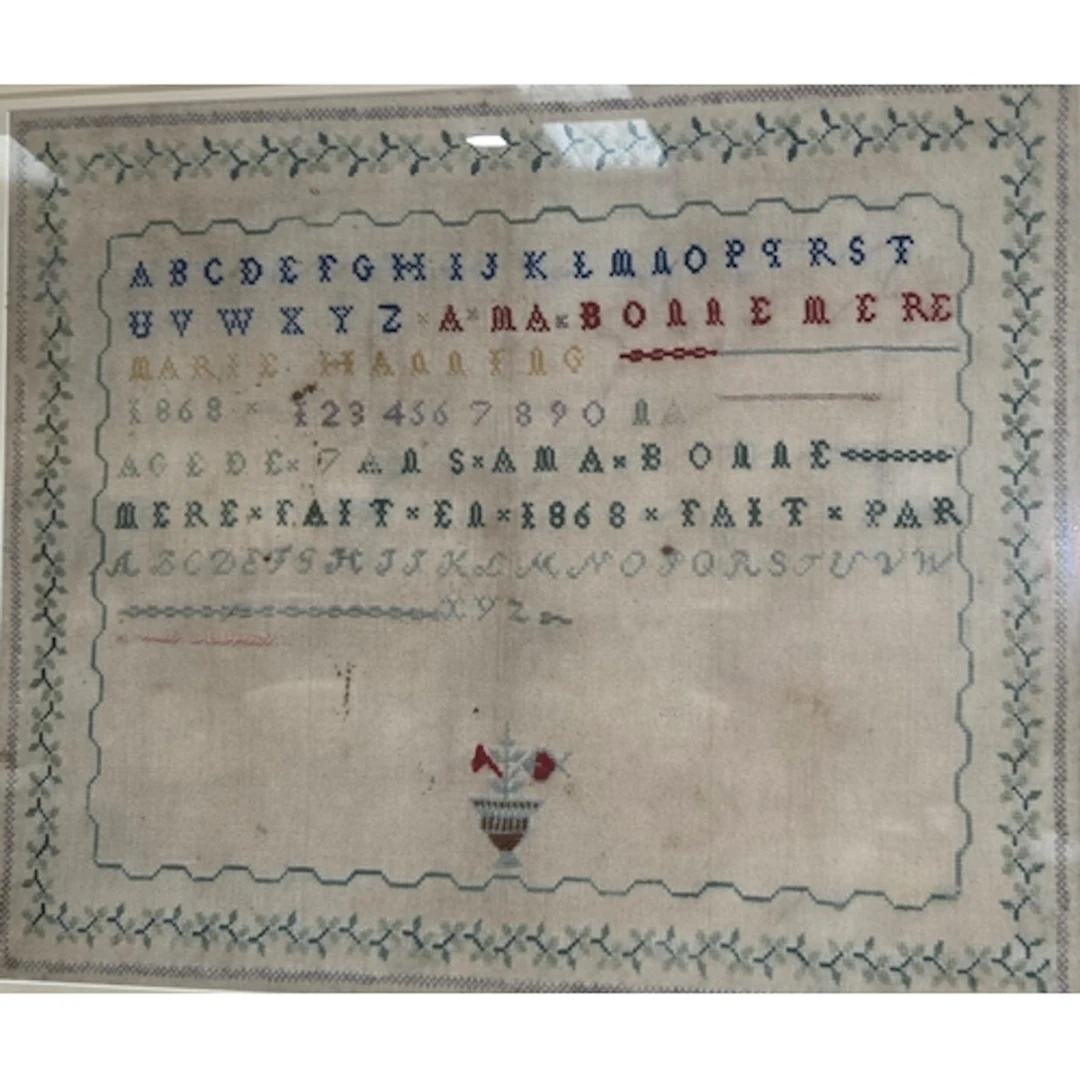A 19th century sampler by Marie Hanning 1868, 43 x 54cm, mou...