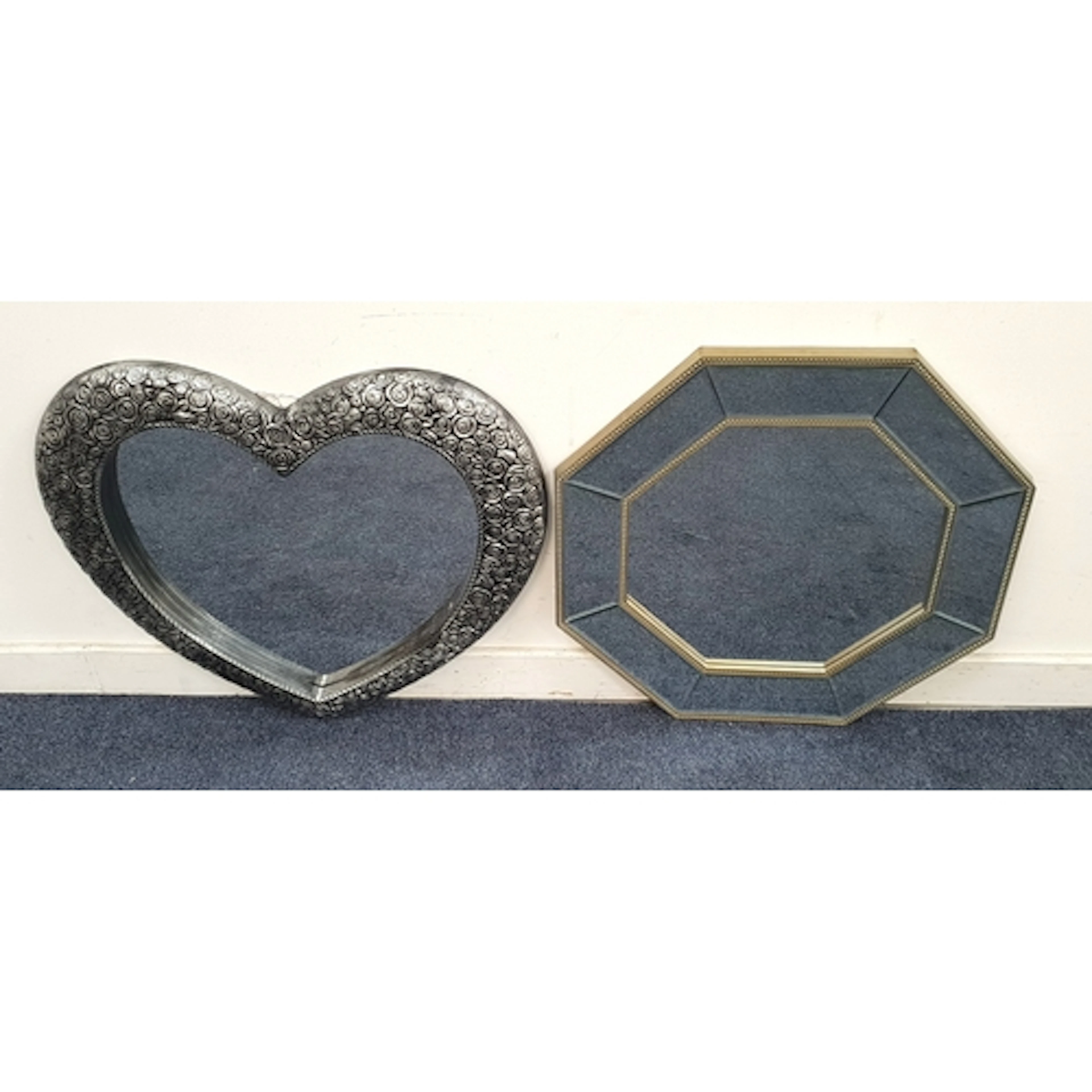TWO CONTEMPORARY WALL MIRRORS comprising one of heart shape,...