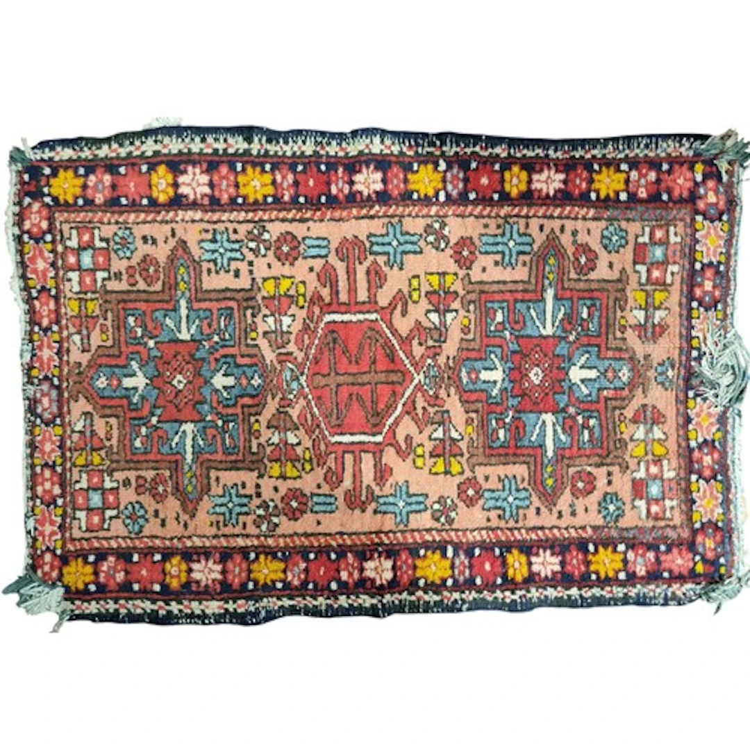 A small Persian Carpet with faults. 105 x 70 cm approx.