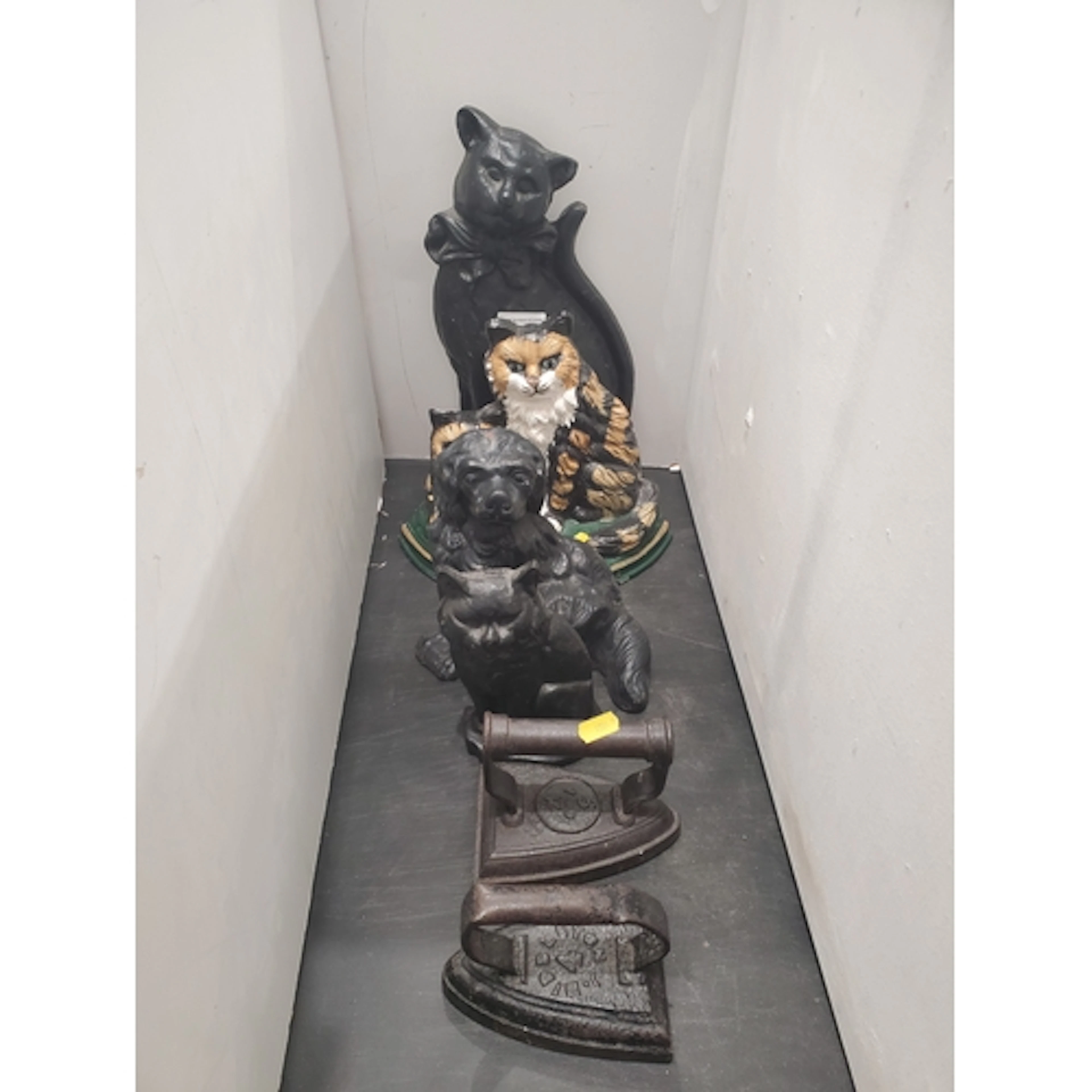 Three cast iron cat Doorstops, a dog Doorstops and two Flat ...