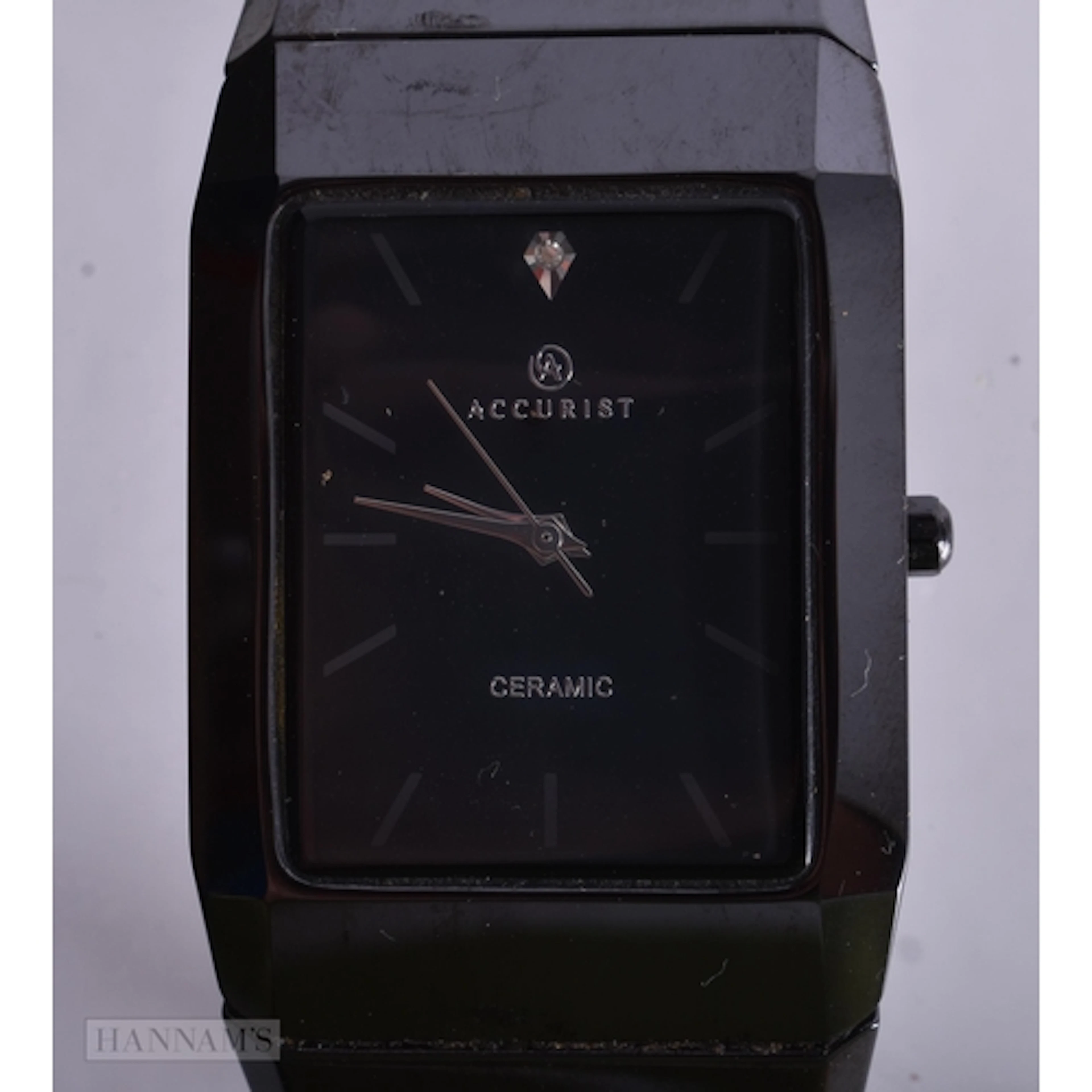 A CERAMIC ACCURIST WATCH. 3.1 cm diameter including crown