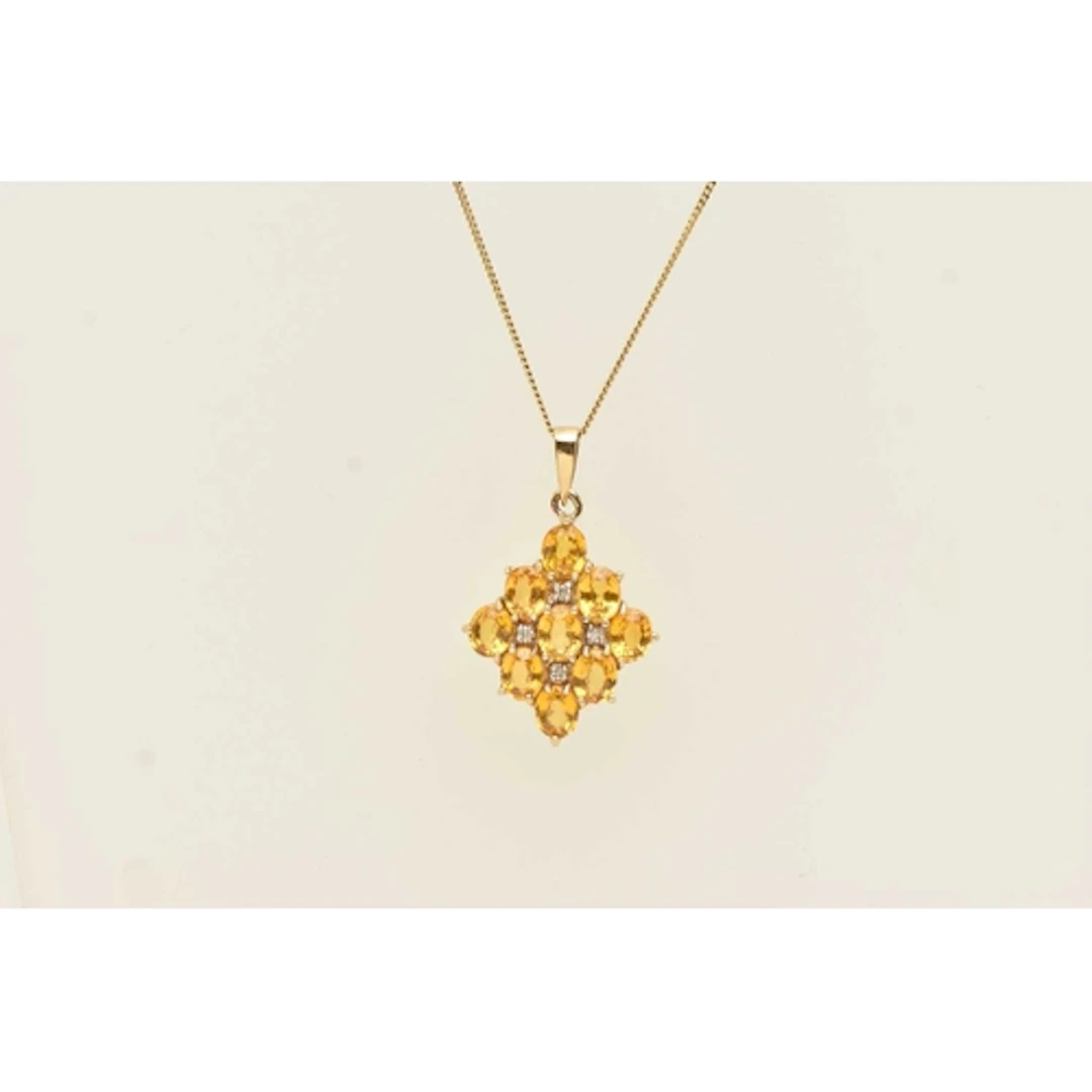A 9CT YELLOW GOLD GEM SET PENDANT NECKLACE, oval cut yellow ...