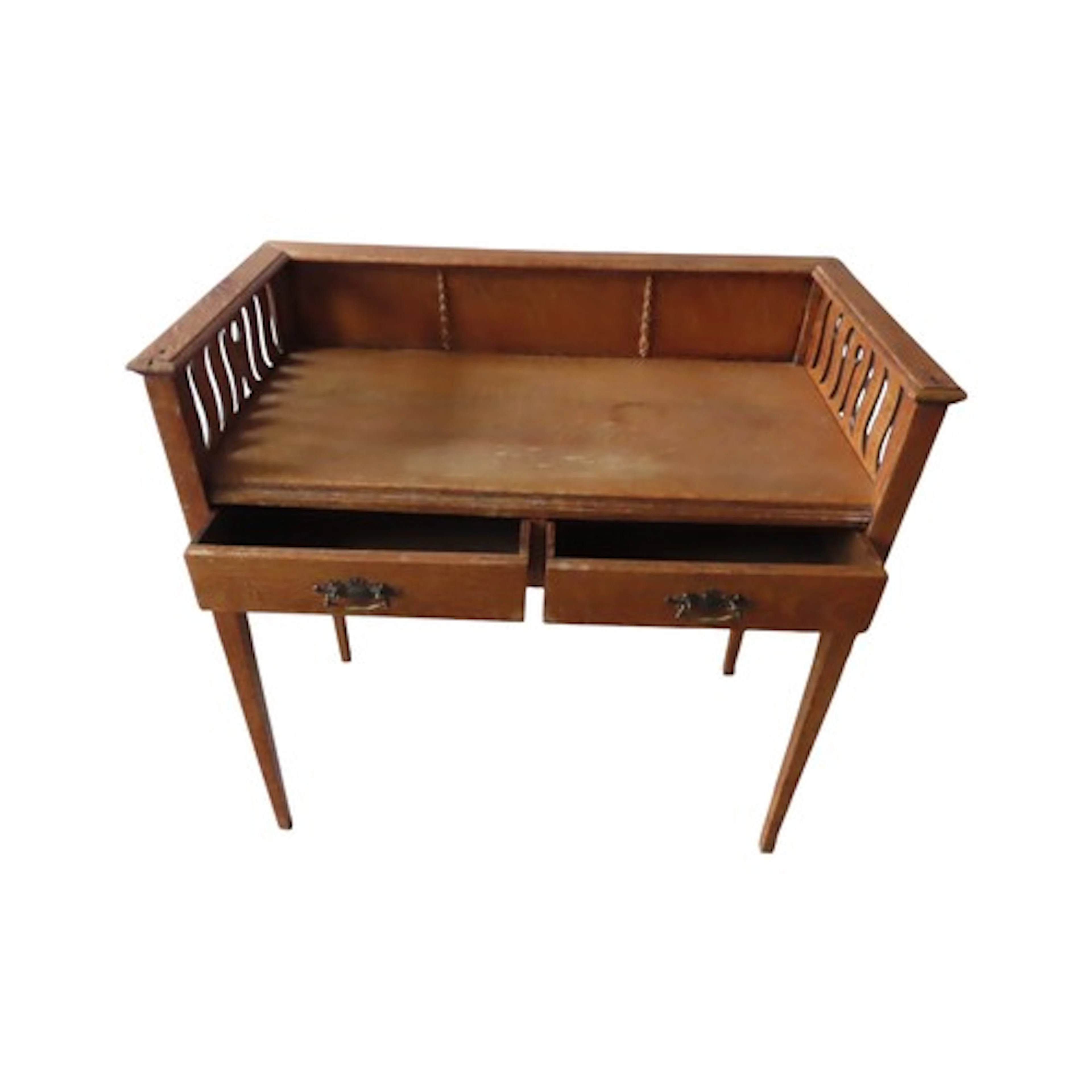 An Arts & Crafts oak side table/desk with raised and partial...