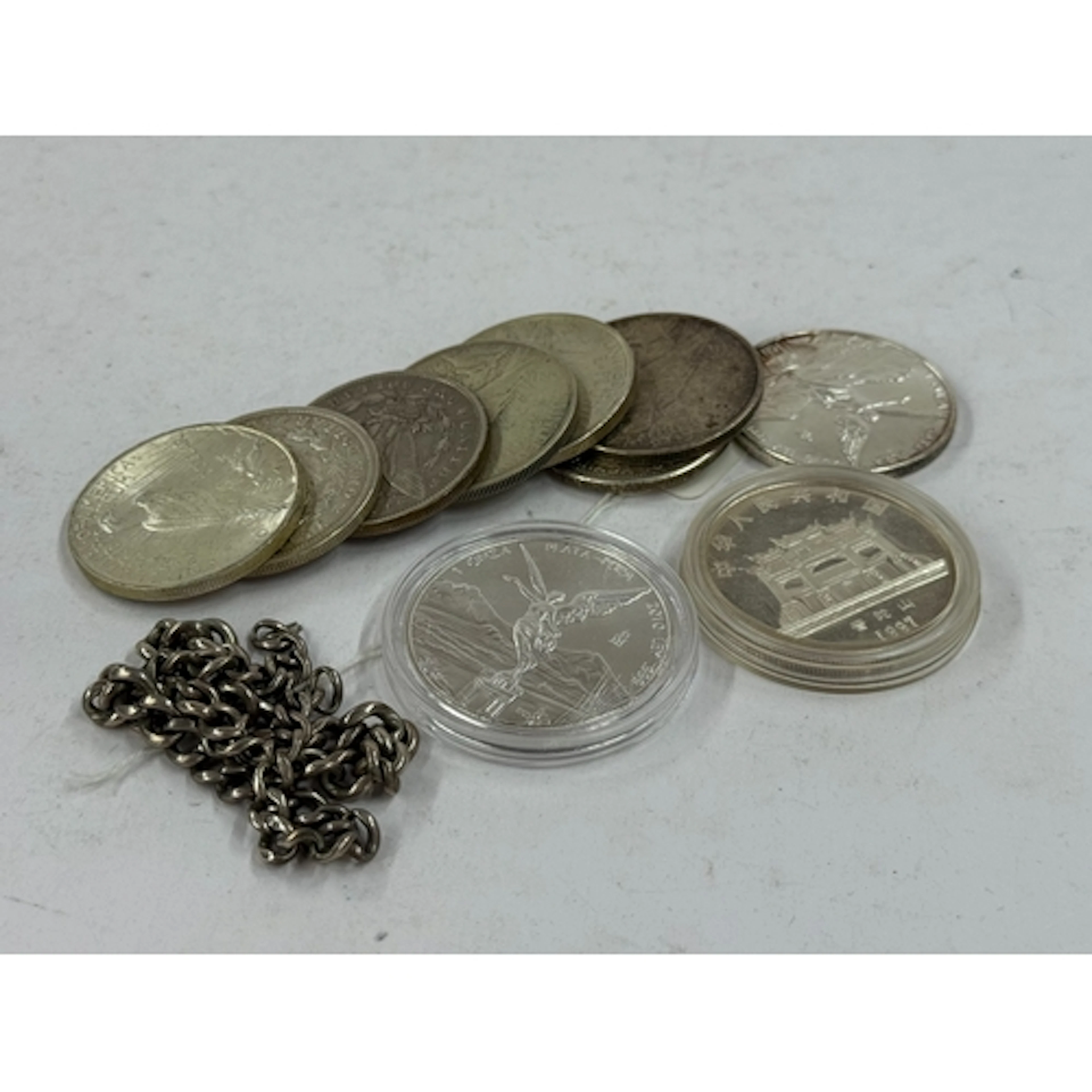 Coins: six US Silver dollars, 1922x3, 1921, 1892, and 1923, ...