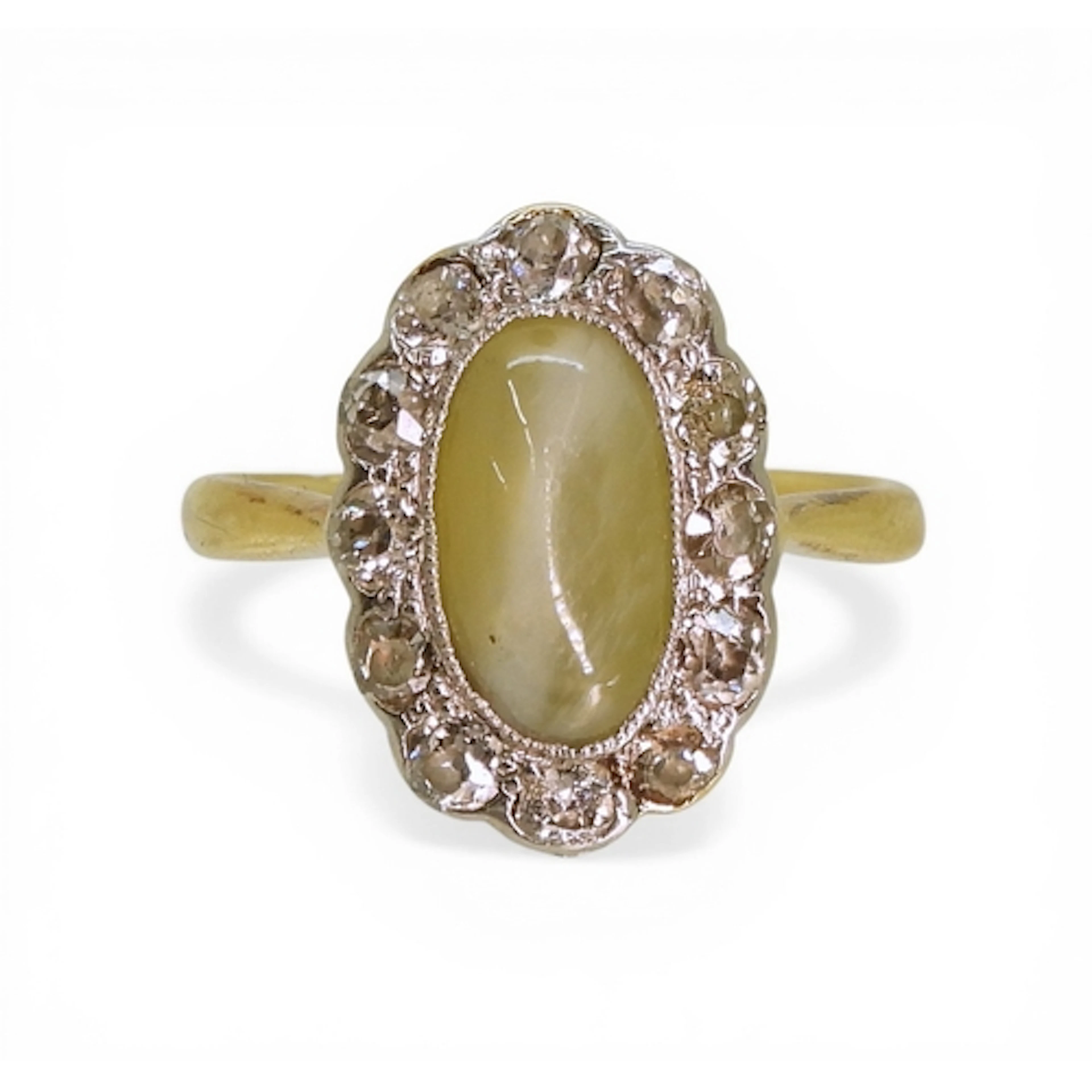 A CHRYSOBERYL & DIAMOND RING made in 18ct gold, set with...