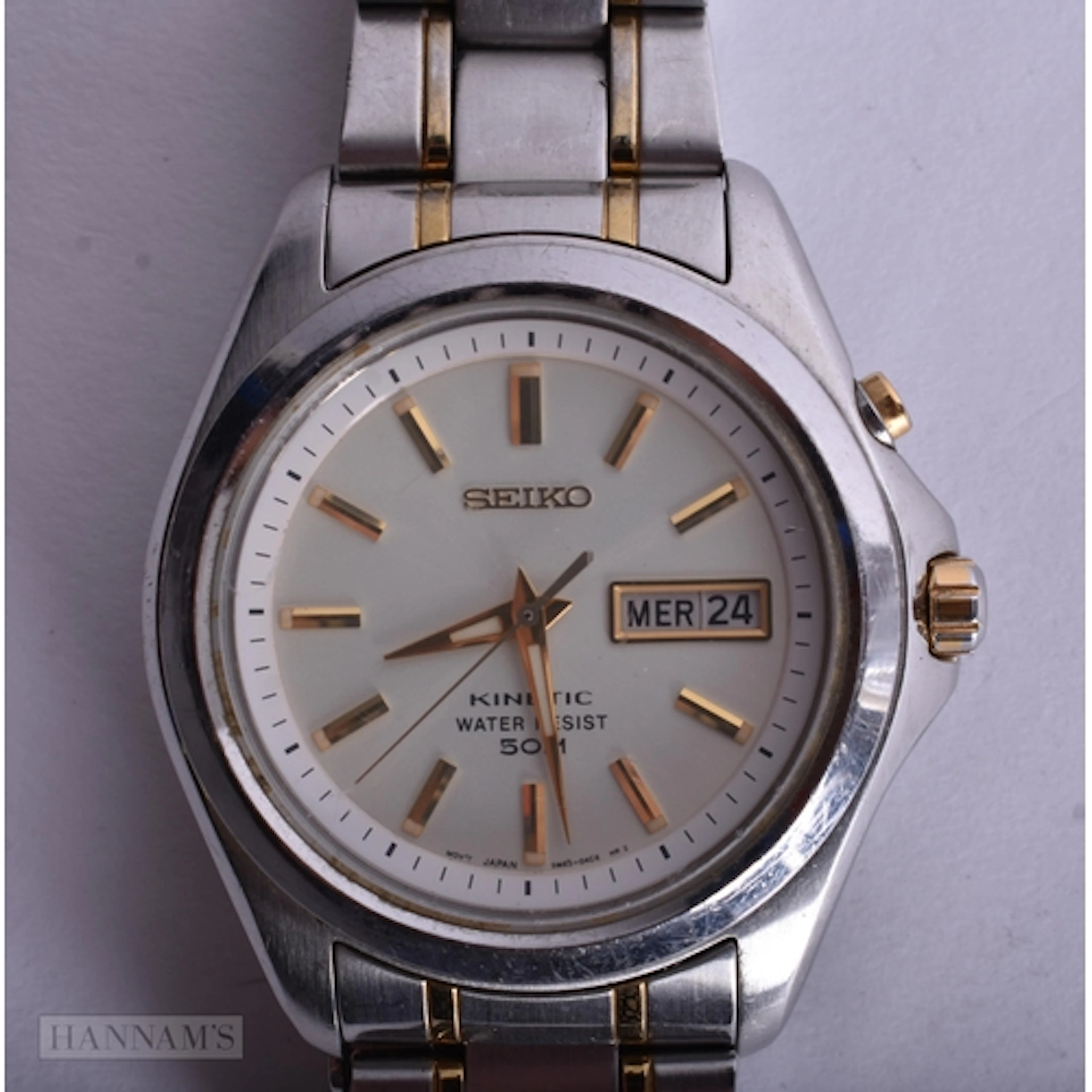 A Seiko Kinetic Watch with Stainless Steel and Gold Accented...