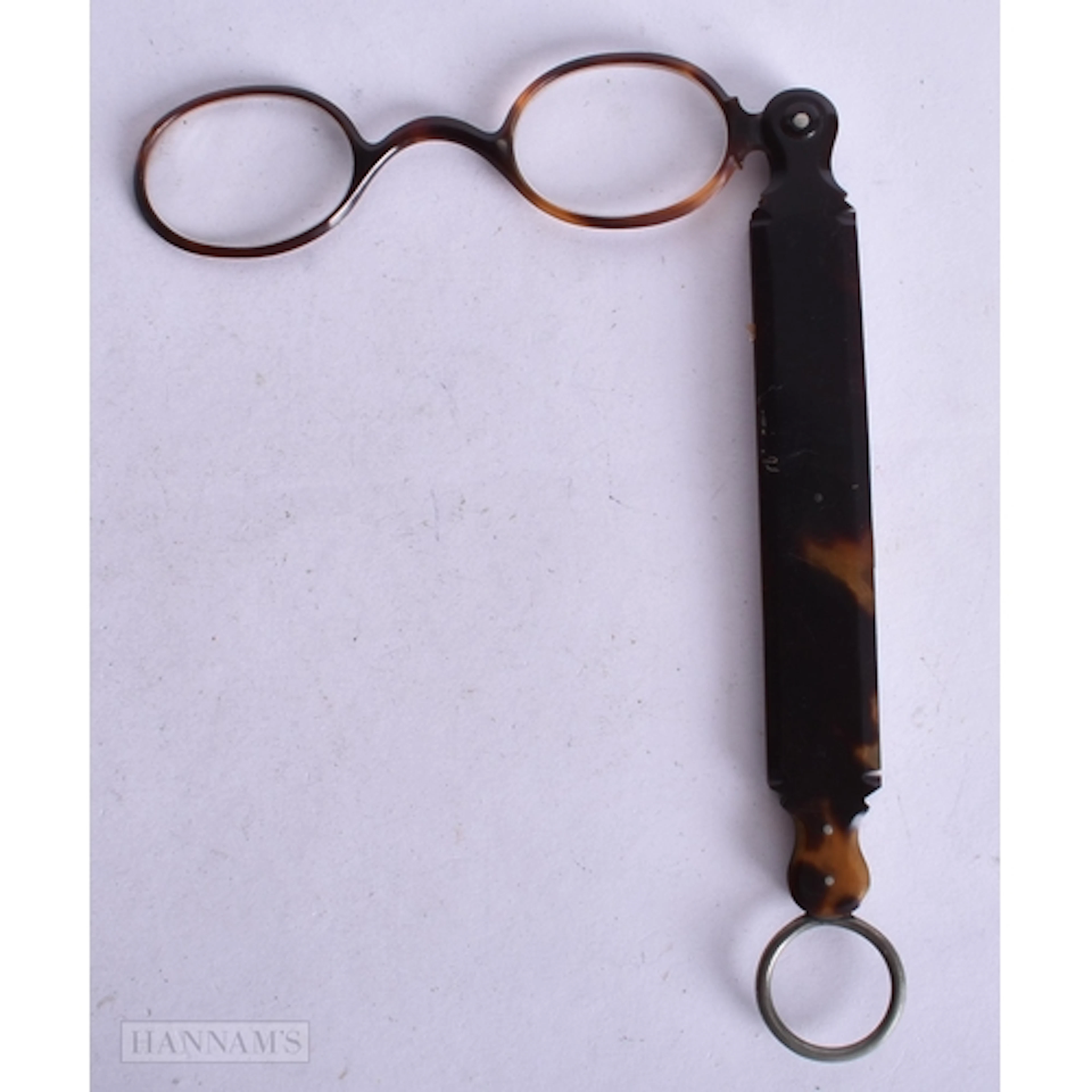 A LARGE PAIR OF TORTOISESHELL LORGNETTES. 24 cm long.