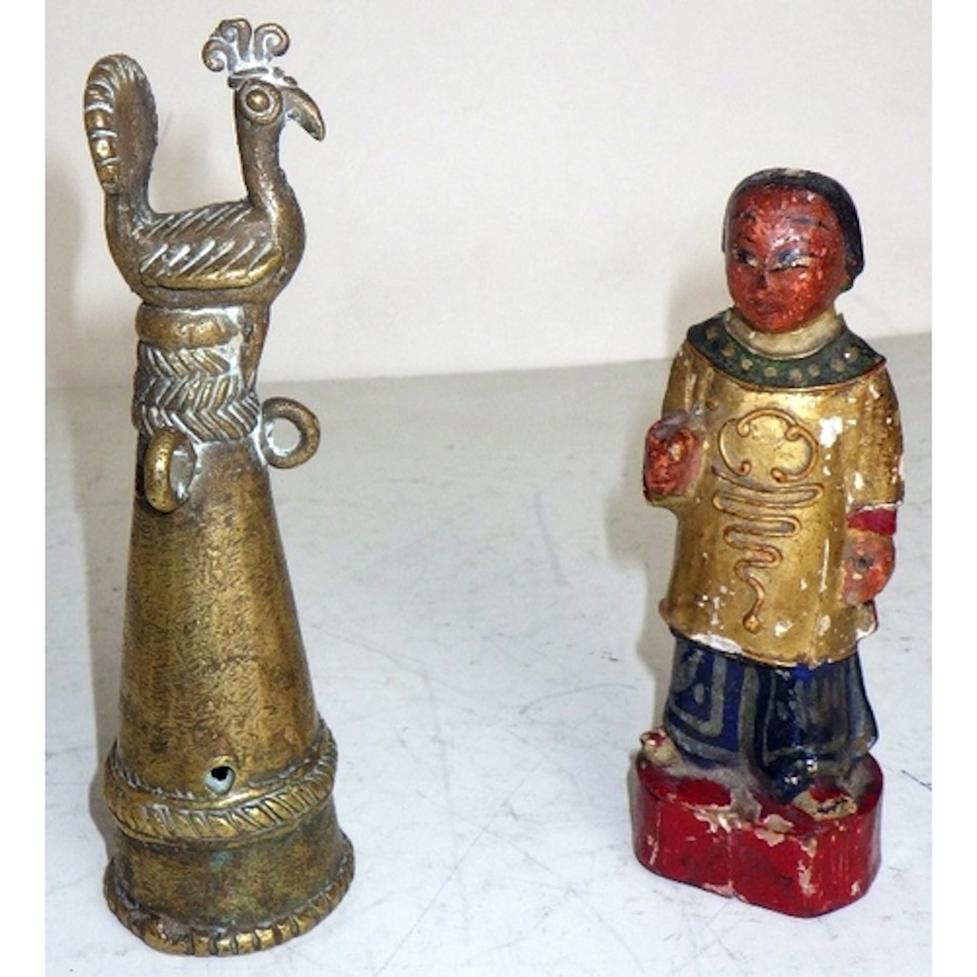 An Indian brass finial, 14cm tall, together with a carved po...