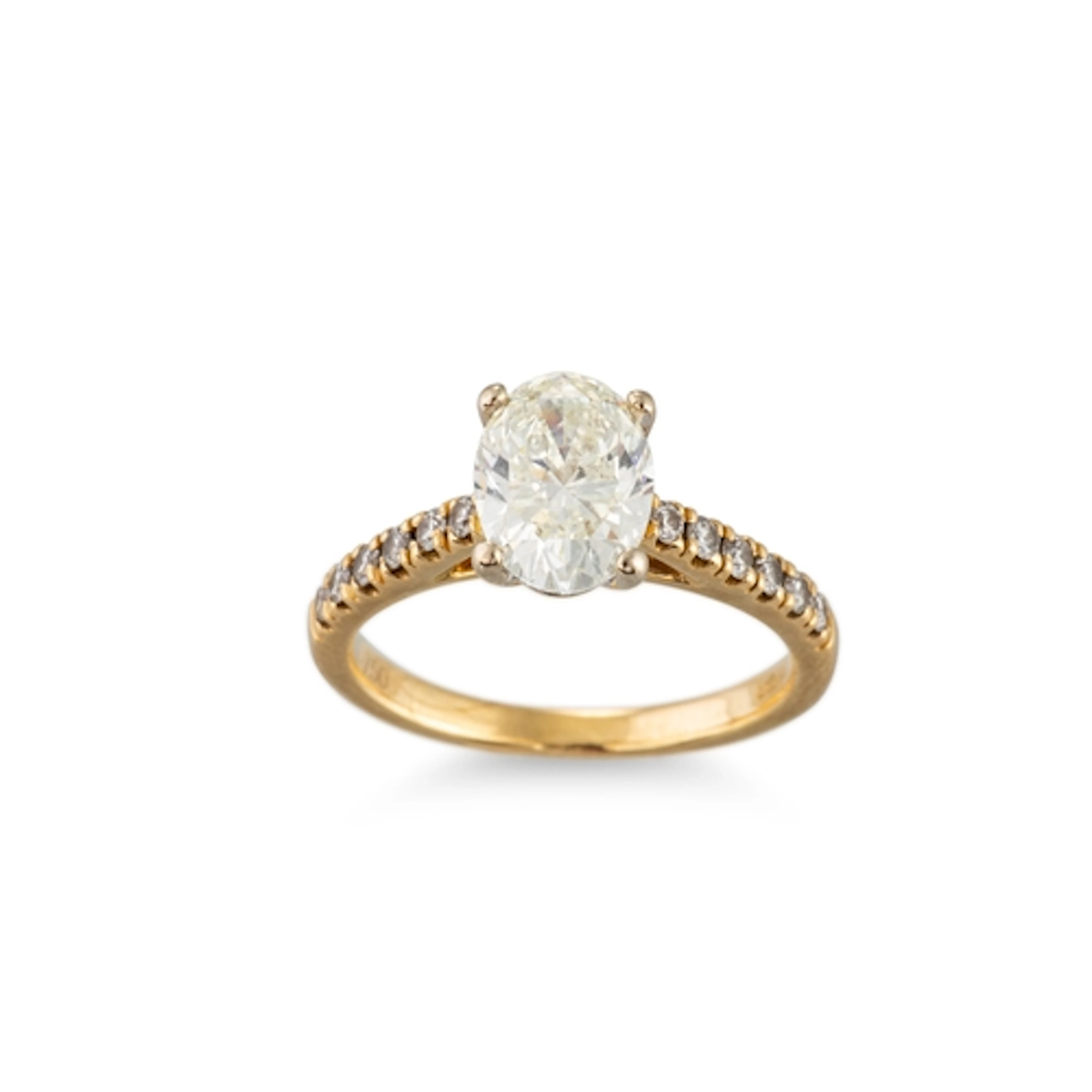 AN OVAL DIAMOND SOLITAIRE RING, with a diamond set band, set...
