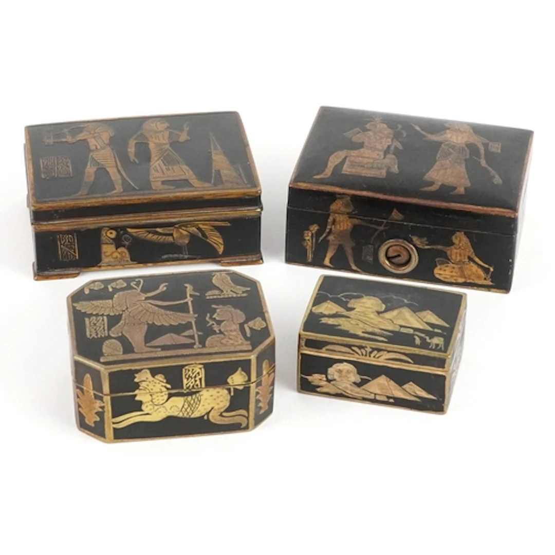 Four early to mid 20th century Egyptian Revival damascene tr...